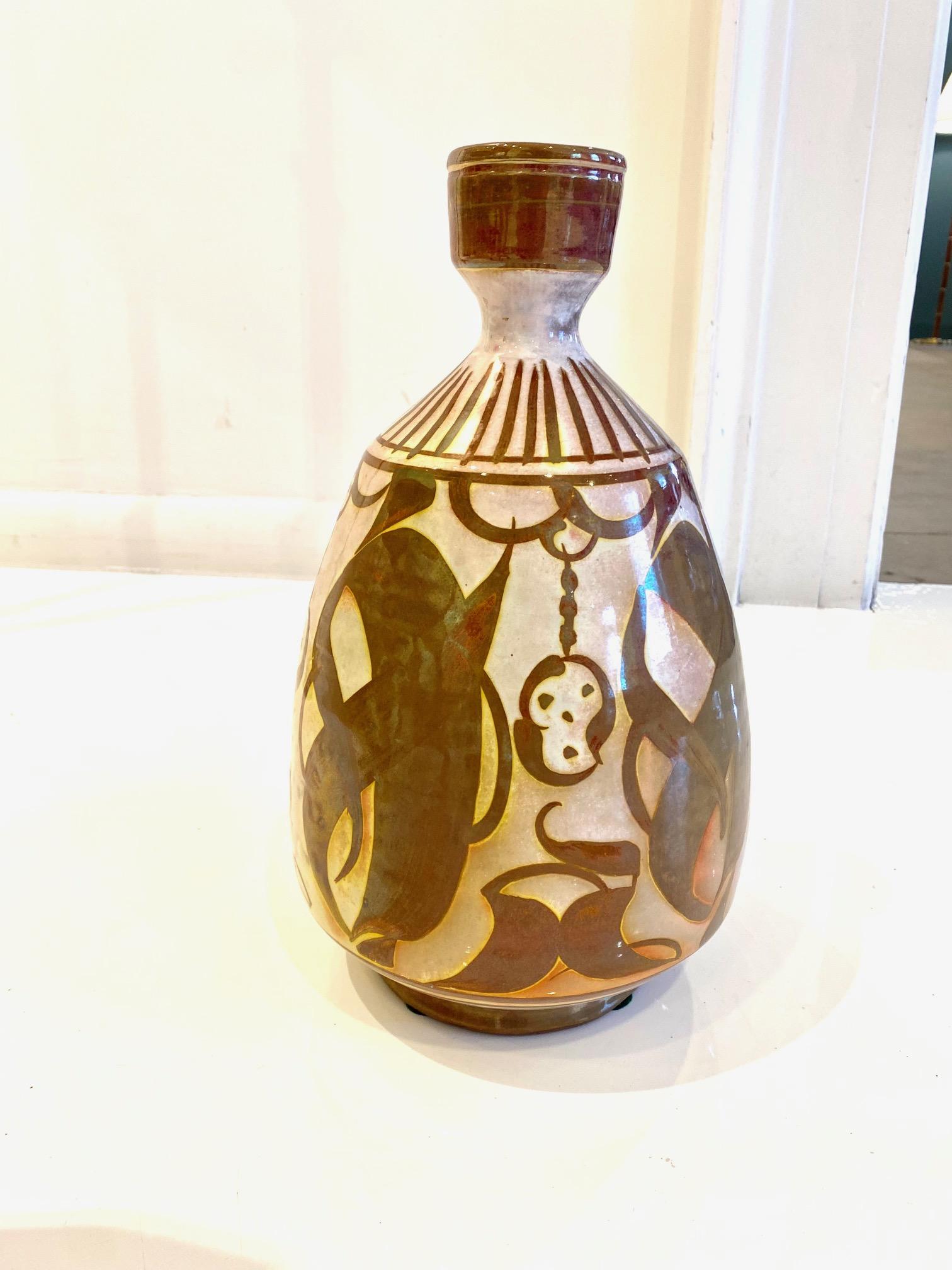 Maroon and White Ceramic Bottle by Alan Caiger Smith marked 82.AL, -2 and with three other script marks England: circa 1980. Alan Caiger-Smith is a ceramicist, painter, and published scholar, best known for his tin-glazed lusterware, hand-decorated
