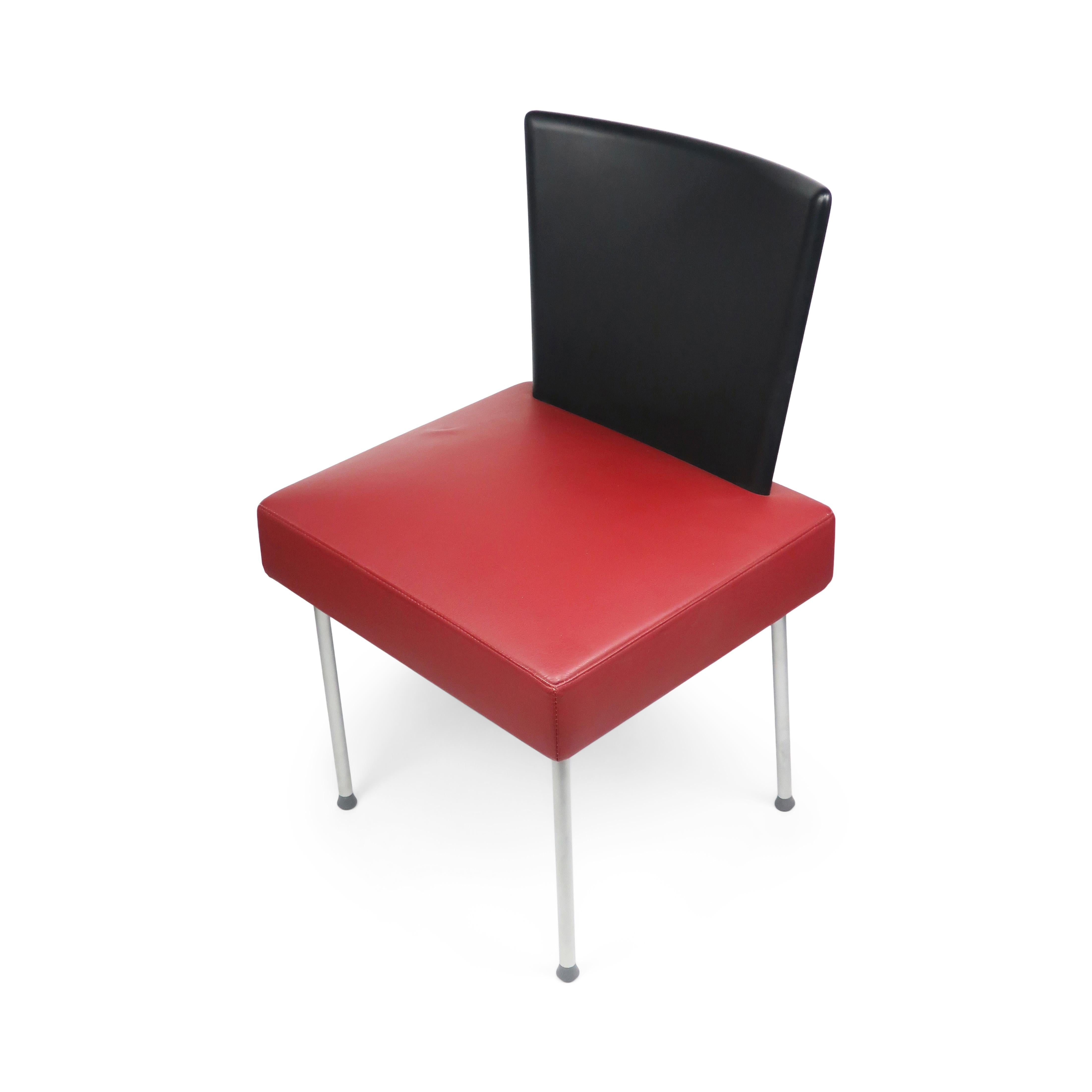 A stunning Calvi chair with a square maroon leather seat, black plastic back, and slender silver metal legs designed by Gijs Papavoine in 1997 for Montis, a Dutch manufacturer. Perfectly fits the aesthetic of mid-1990s design and furniture. 

In