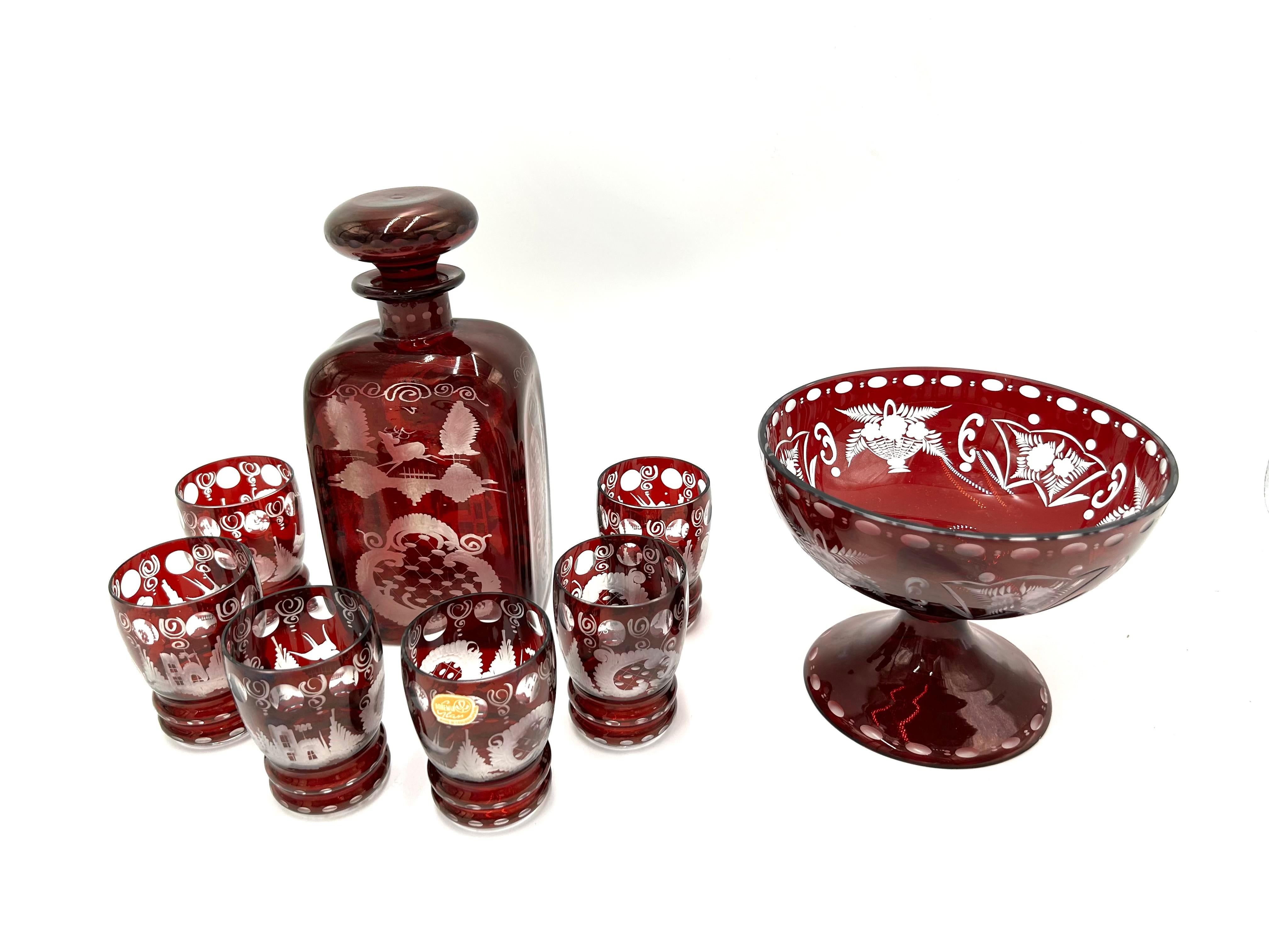 Ruby glass liqueur set: decanter, 6 glasses and a plate.

Produced by Bohemia in Czechoslovakia in the 1960s.

Original sticker retained

Very good condition without damage

Measures: carafe: height 21cm, width 9.5cm, depth 6.5cm

glass:
