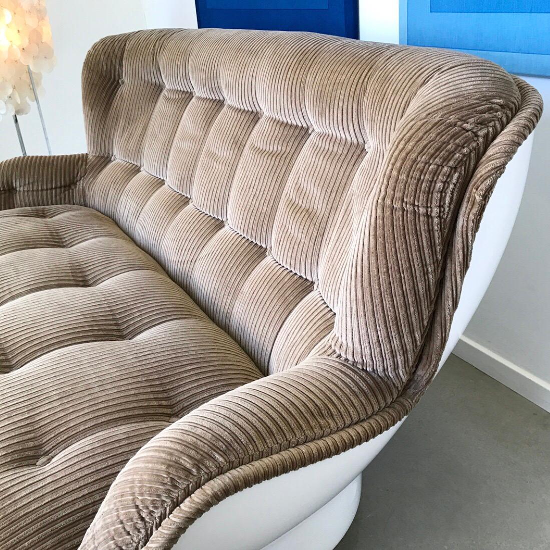 Rare sofa by Marque Dupont for Airborne International.

A real Space Age contemporary piece of French design from 1970. 

All original fiberglass shell with original light brown corduroy upholstery. Both cushions and the shell is in an excellent