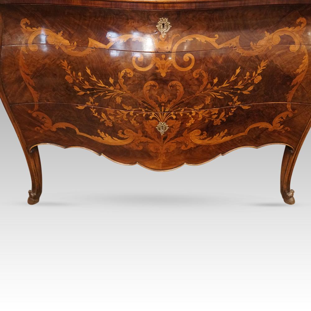 Marquetry bombe commode
This marquetry bombe commode was made circa 1920.
The walnut is inlaid with fine marquetry to the front top and sides, the marquetry of elaborate patterns of delicate foliate sprays.
It is fitted 3 drawers that open to reveal