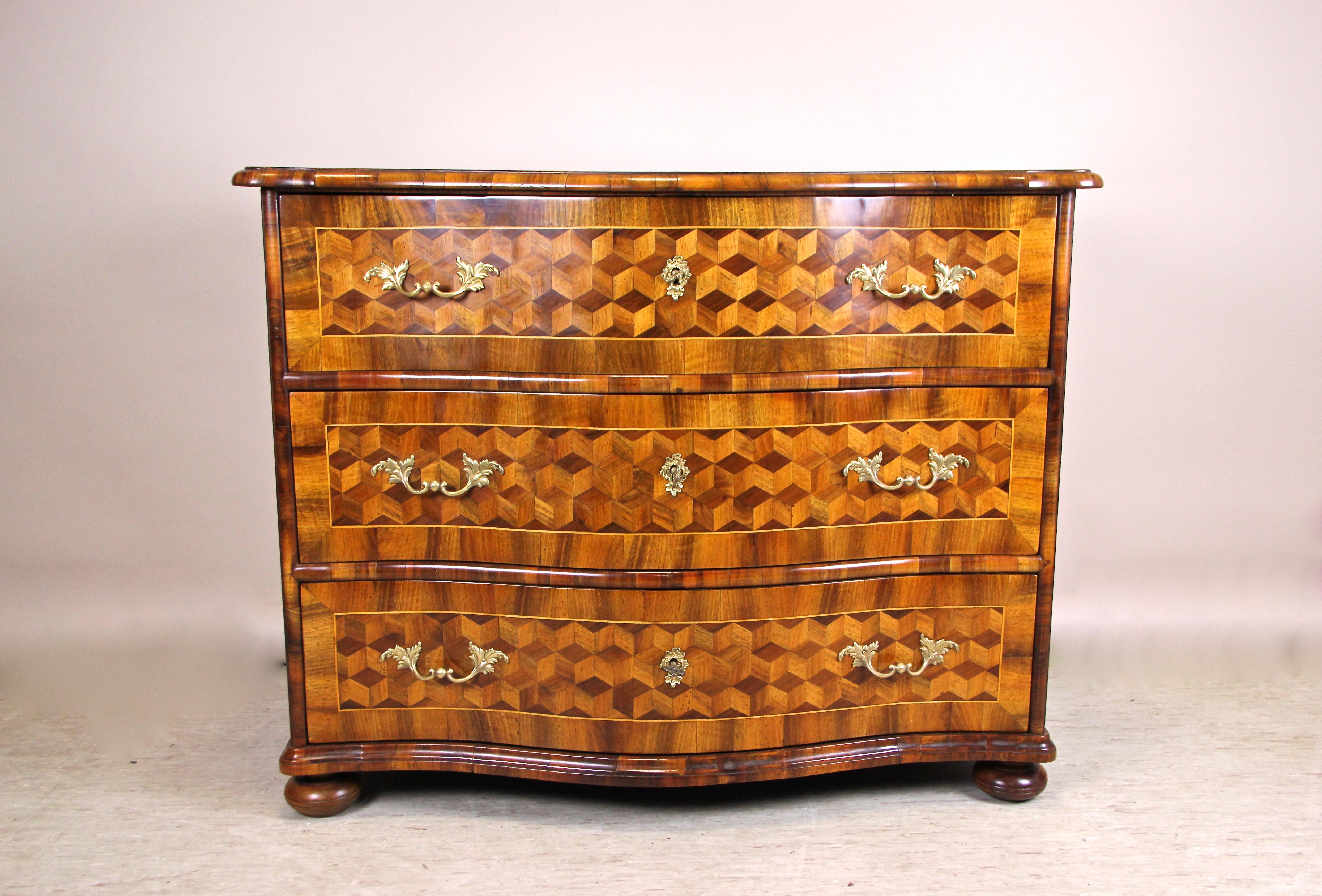 Absolute breathtaking Marquetry chest of drawers from the Baroque period in Austria circa 1760. This unique 18th century nut wood veneered Baroque chest impresses with a stunning cube-marquetry building an tremendous 3D effect. All marquetry