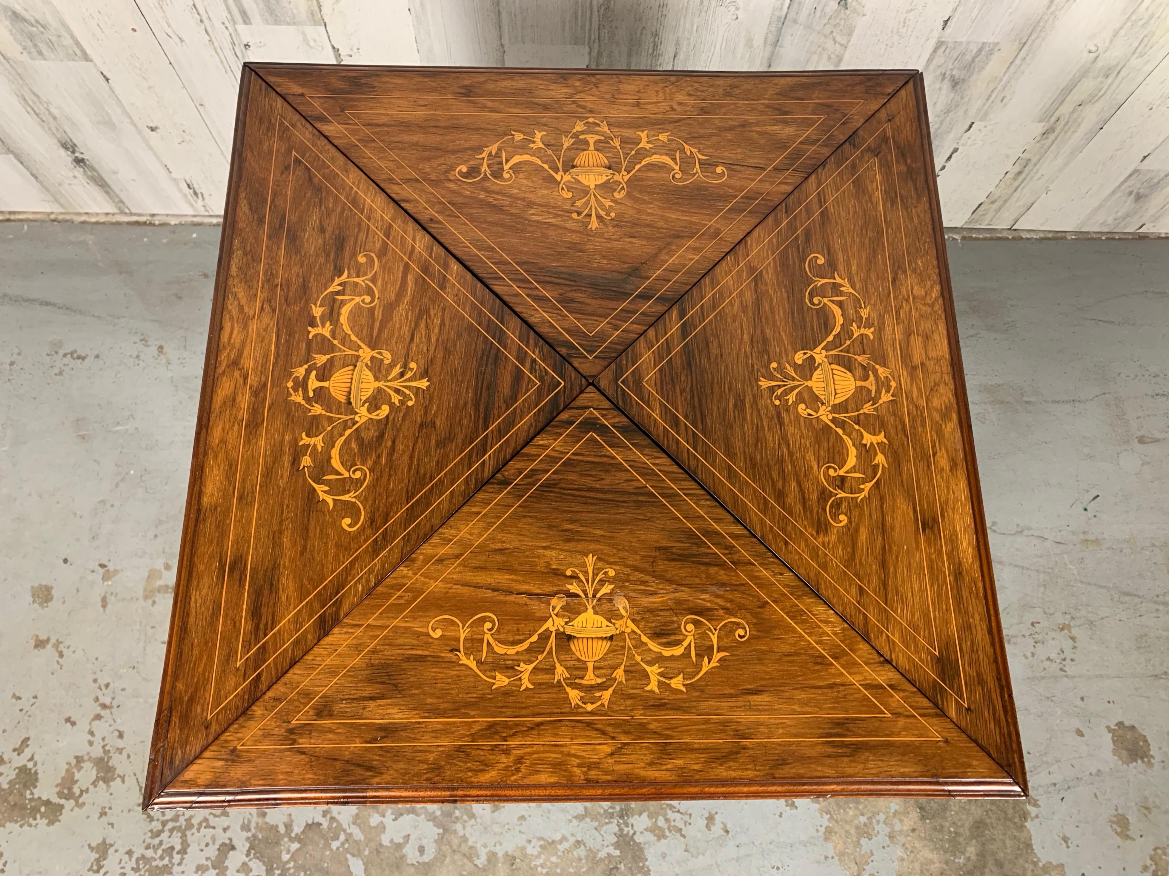Antique Edwardian period rosewood envelope game table with foliate marquetry design. New felt on the card playing surface. The table measures 30