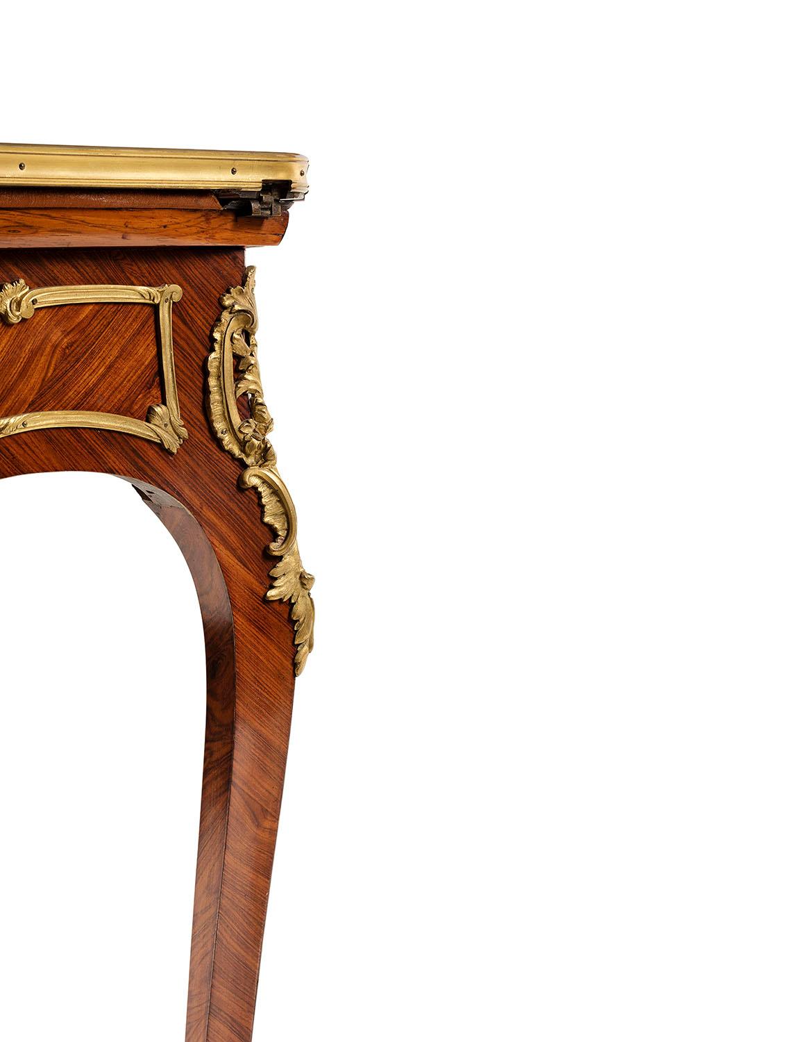 The flip top game table in marquetry with ormolu bronze have a drawer ,bear the mark F.Linke ,the felt interior surface is in mint condition
this is call in french 