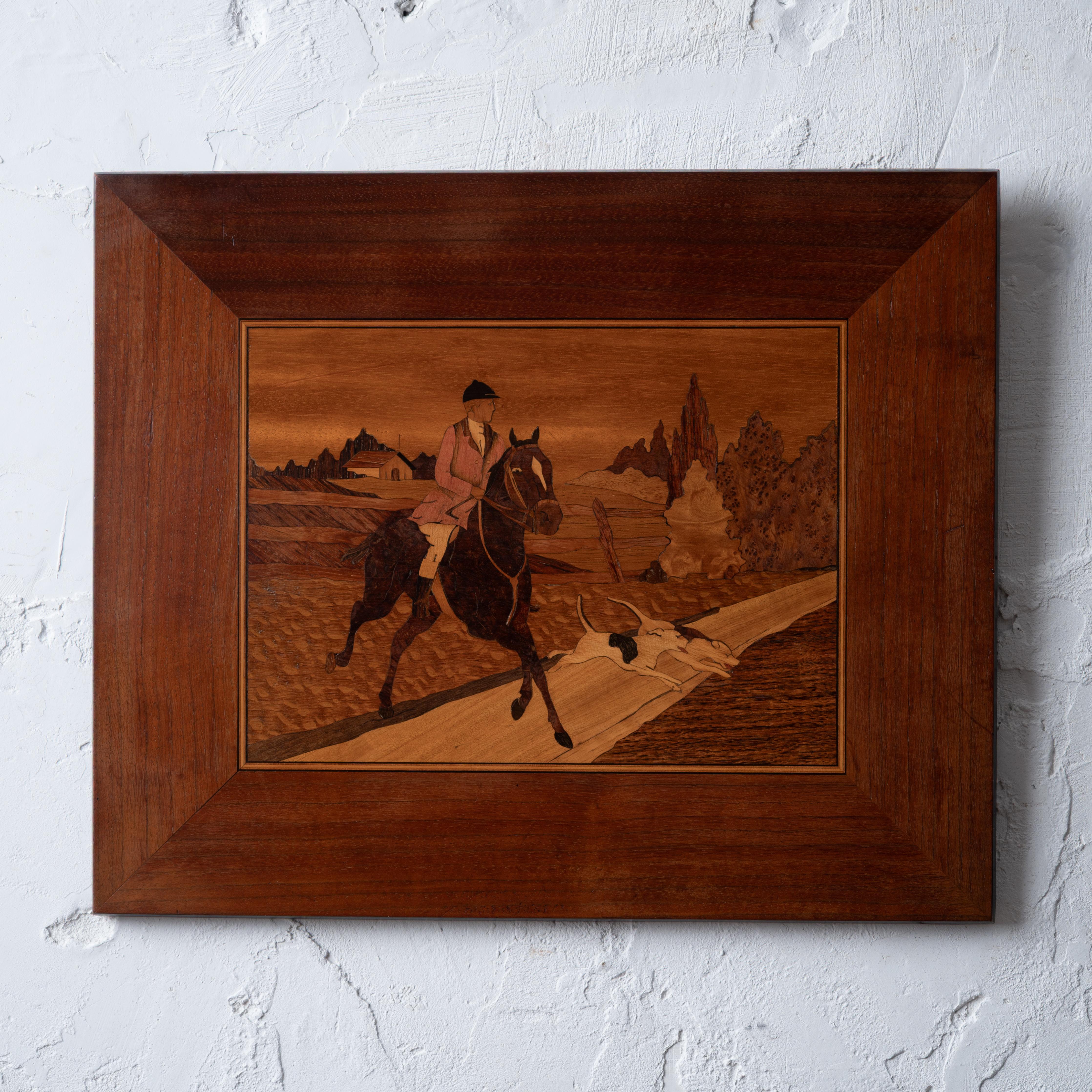 A marquetry hunt scene decorative panel, circa 1920.



15 ¾ inches wide by 13 inches tall



