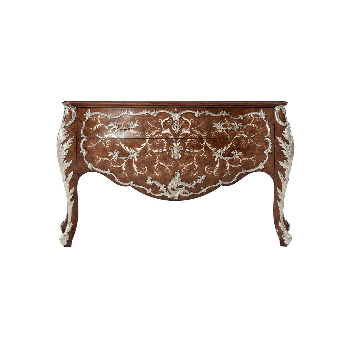 A magnificent mahogany and marquetry bombé Commode, veneered in Chestnut burl throughout and with fine sycamore scrolling vine marquetry inlaid leaves and flowers; overlaid with finely cast rubbed nickel-brass and mounts and handles, on bold