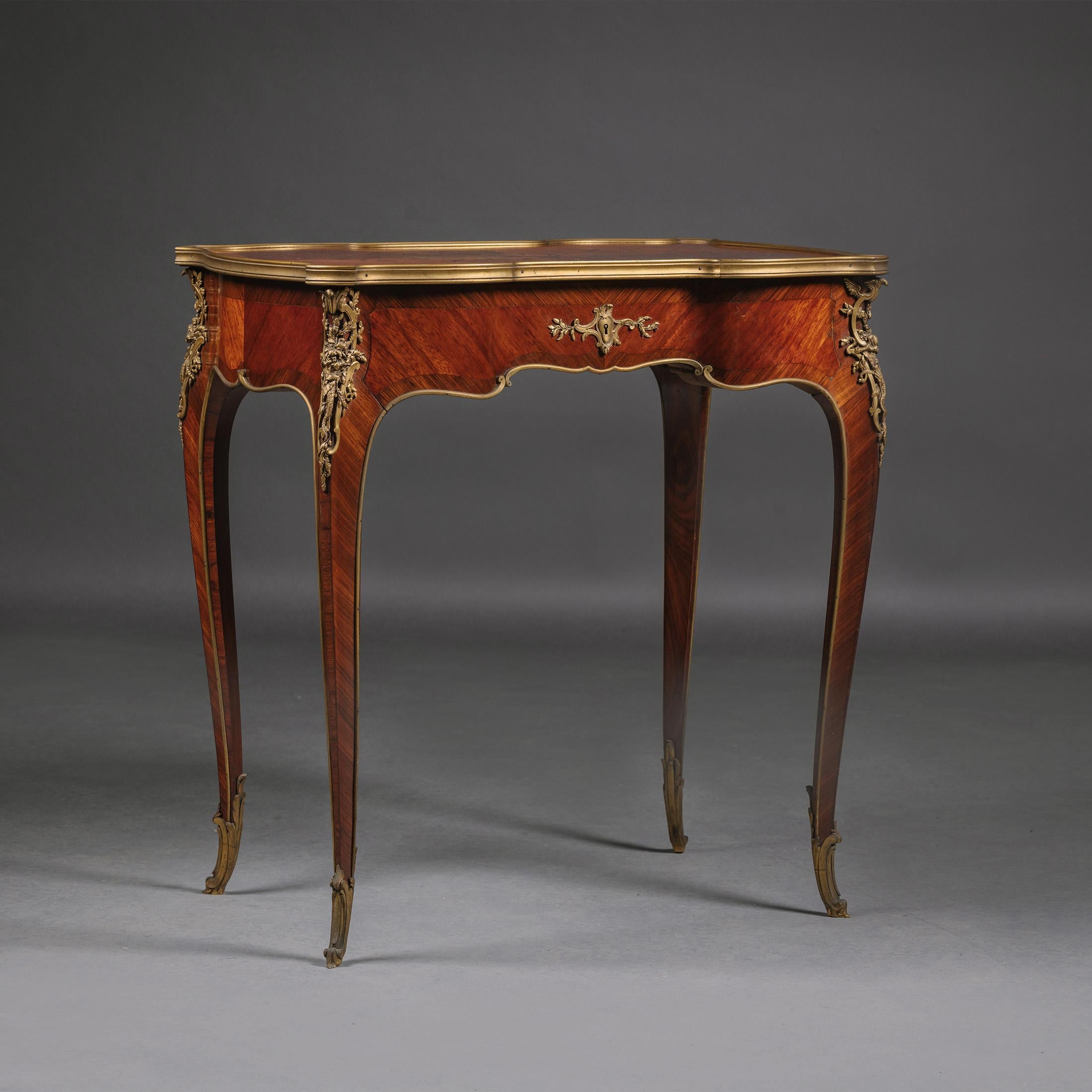 A Gilt-Bronze Marquetry Inlaid Occasional Table, Attributed to Emmanuel Zwiener.

The reverse of the gilt-bronze sabot incised 'Z'

This exquisite table is perfect for a living room or bedroom. It can be used as a small writing or occasional, side
