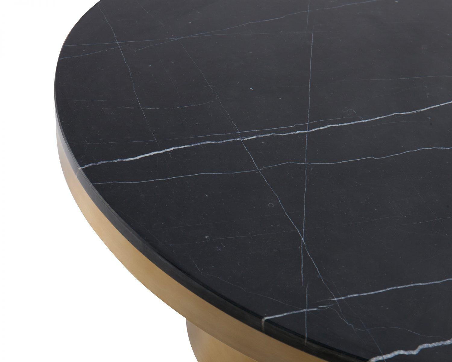 Marquina black marble and brass coffee table

Materials: Marquina black marble top, brushed brass frame and legs
Dimensions: D 90 x H 38 cm.
