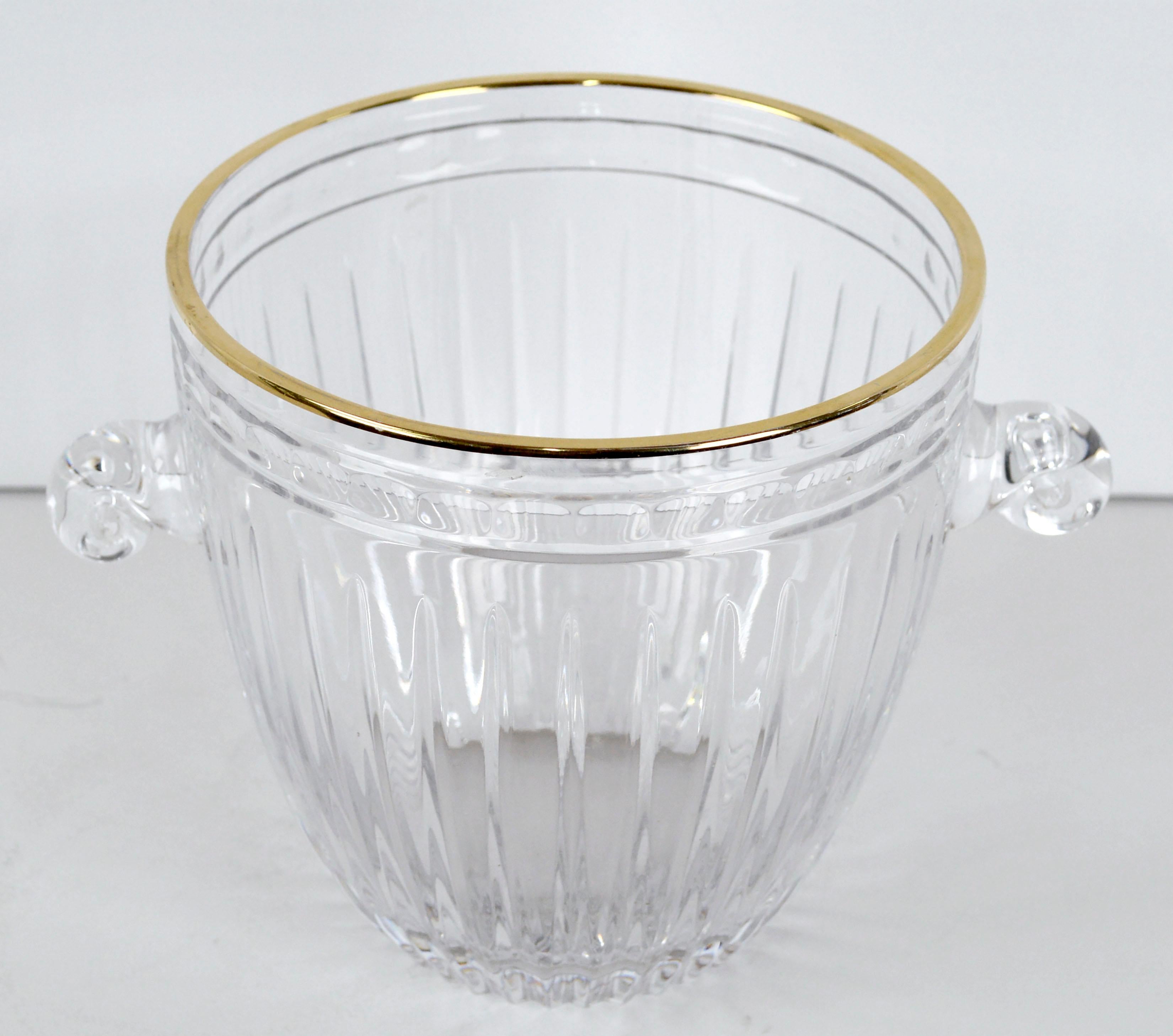 Vintage late 20th century Marquis by Waterford Crystal ice bucket wine cooler with gold trim. This elegant wine and champagne chiller features hand cut vertical details, scroll handles, and a gold rim. Marquis by Waterford logo is etched onto