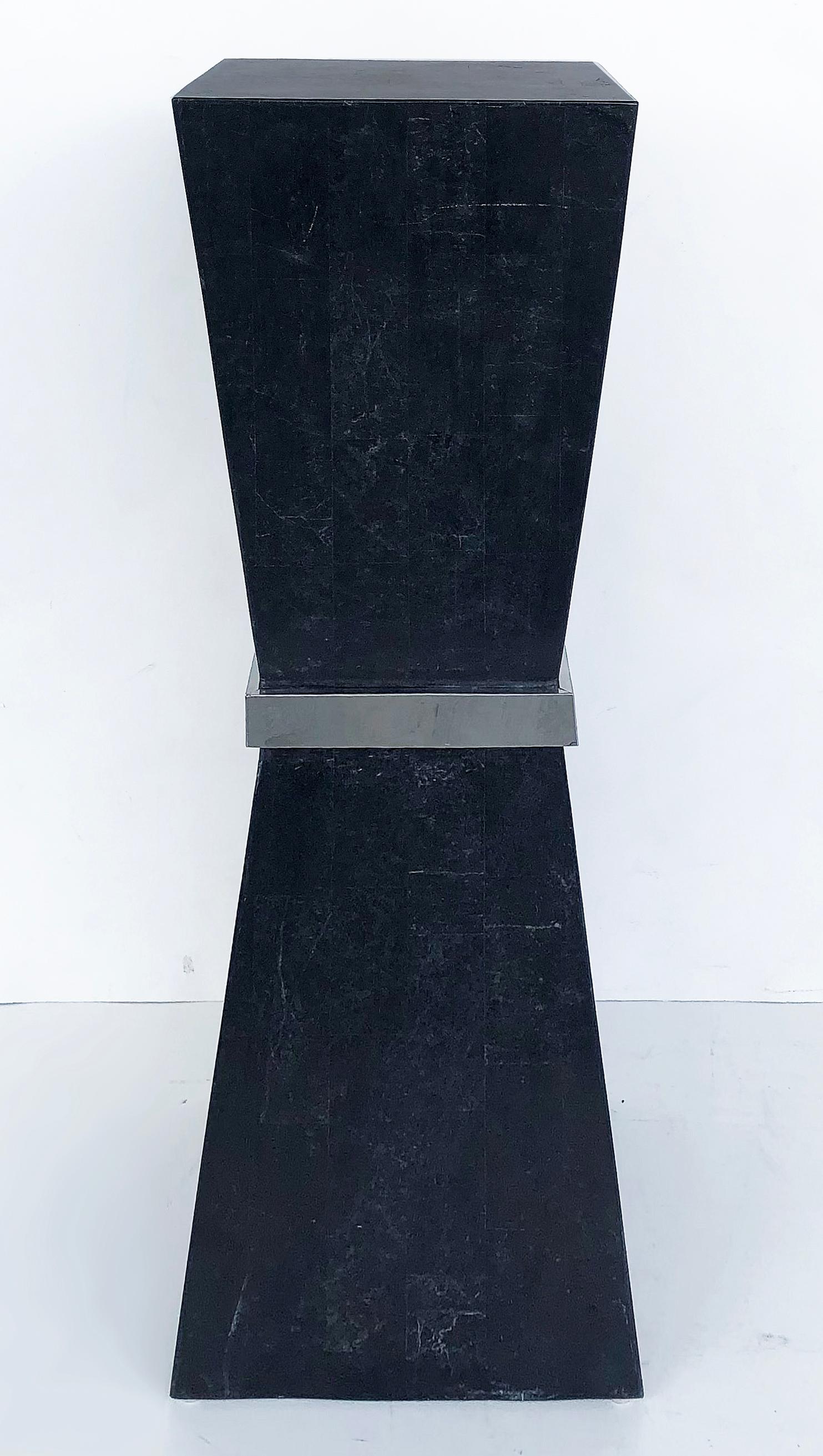Marquis Collection of Beverly Hills stone pedestal with nickel band.

Offered for sale is a contemporary black tessellated stone veneer pedestal with a polished nickel band. The pedestal retains a label underneath which identifies it as a Marquis