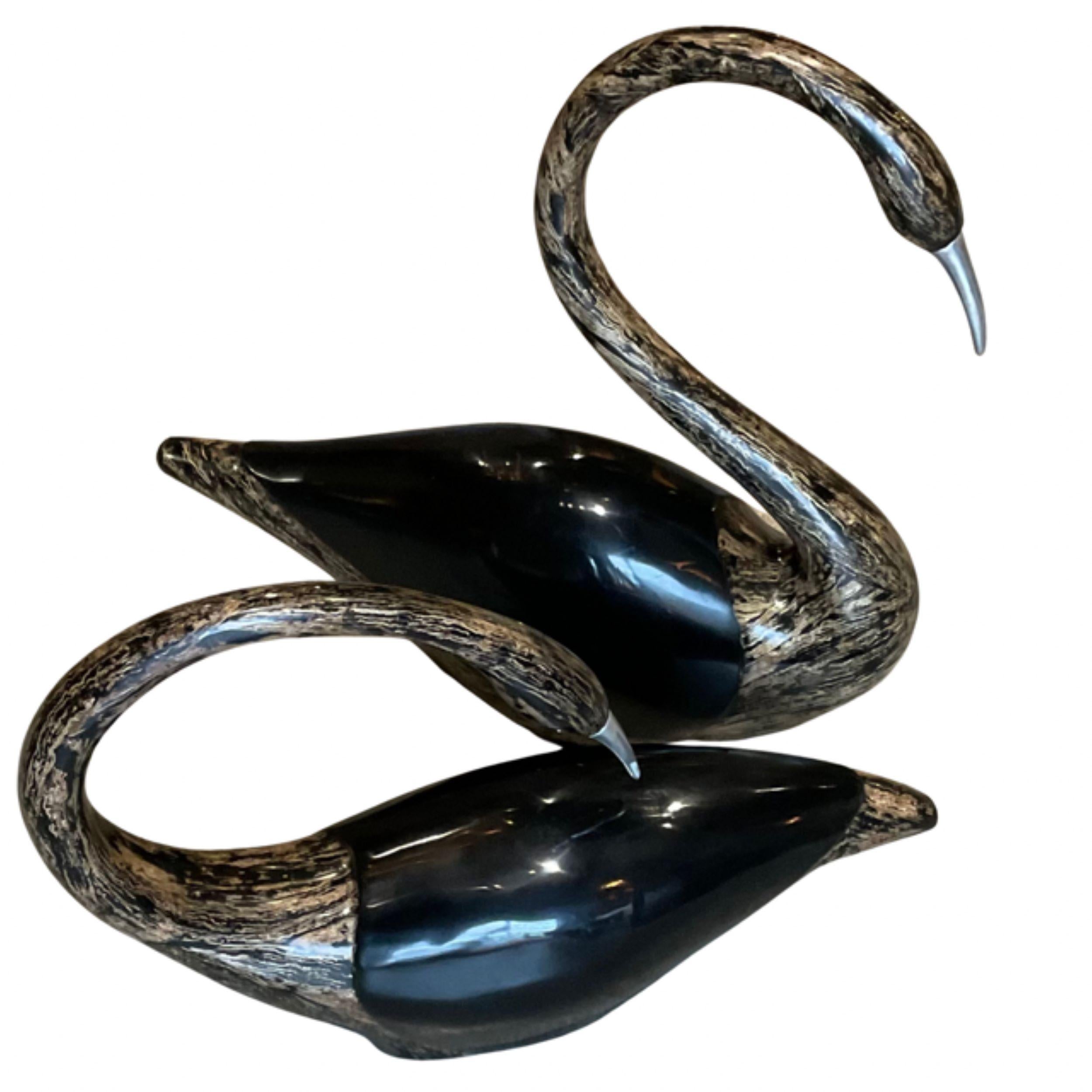 Marquis Collection of Beverly Hills
Pair of Unique Swan Sculptures
Featuring Aluminum Beaks
Black Lacquer body with tan & black Lacquer Accents
Both of the Swans have labels on the underside
Measures: Swan 1
 Height : 13.5’
 Width : 20’
