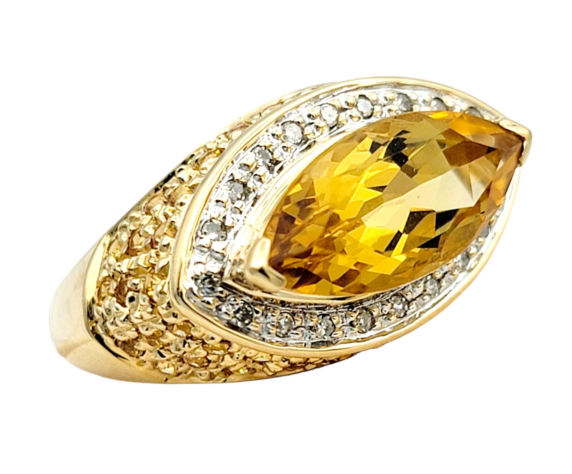 Ring size: 6

This gorgeous citrine, sapphire and diamond ring fills the finger from end to end with warmth and radiance. The 14 karat yellow gold provides a warm backdrop that highlights the gemstones' rich tones, making the piece absolutely