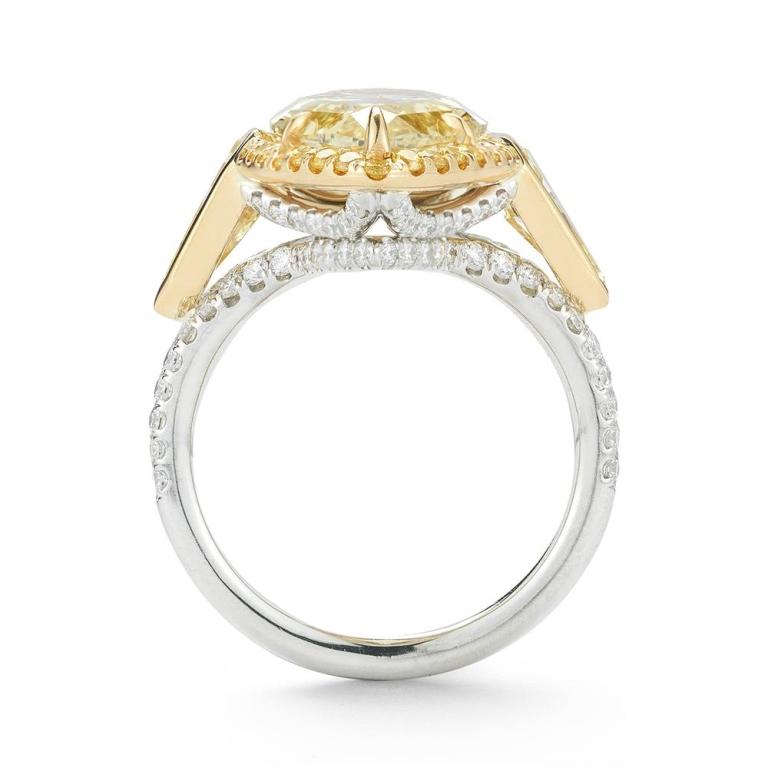 MARQUIS DIAMOND RING A spectacular marquis shaped fancy yellow diamond is featured prominently in an elaborate 18K yellow gold setting Item: # 02761 Metal: 18k W / Y Lab: Gia Diamond Weight: 8.57 ct.
