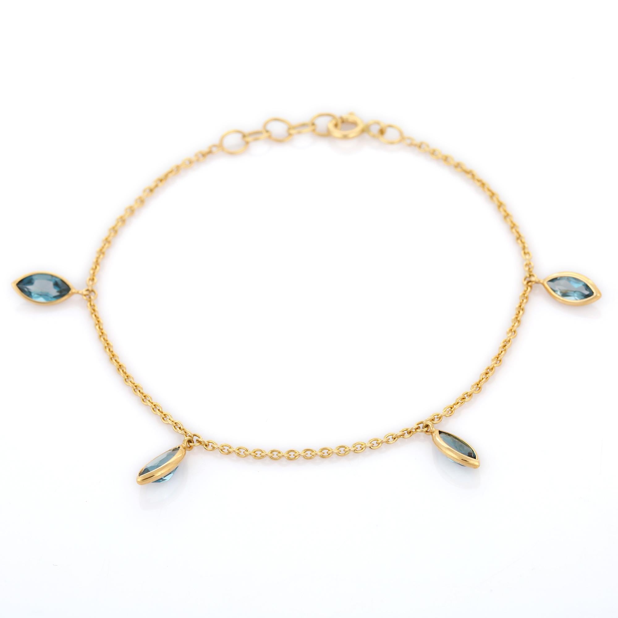 Marquise 2.54 Ct Blue Topaz Dangling Charm Bracelet Inlaid in 18K Yellow Gold In New Condition For Sale In Houston, TX