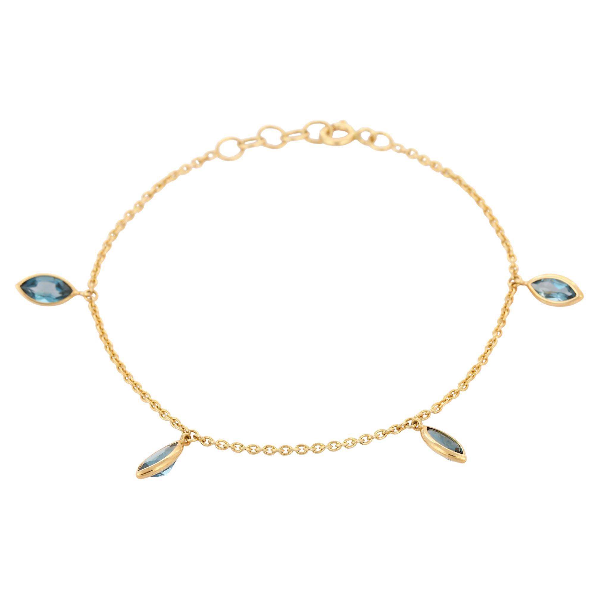 Marquise 2.54 Ct Blue Topaz Dangling Charm Bracelet Inlaid in 18K Yellow Gold For Sale