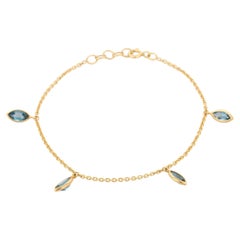 Marquise 2.54 Ct Blue Topaz Dangling Charm Bracelet Inlaid in 18K Yellow Gold