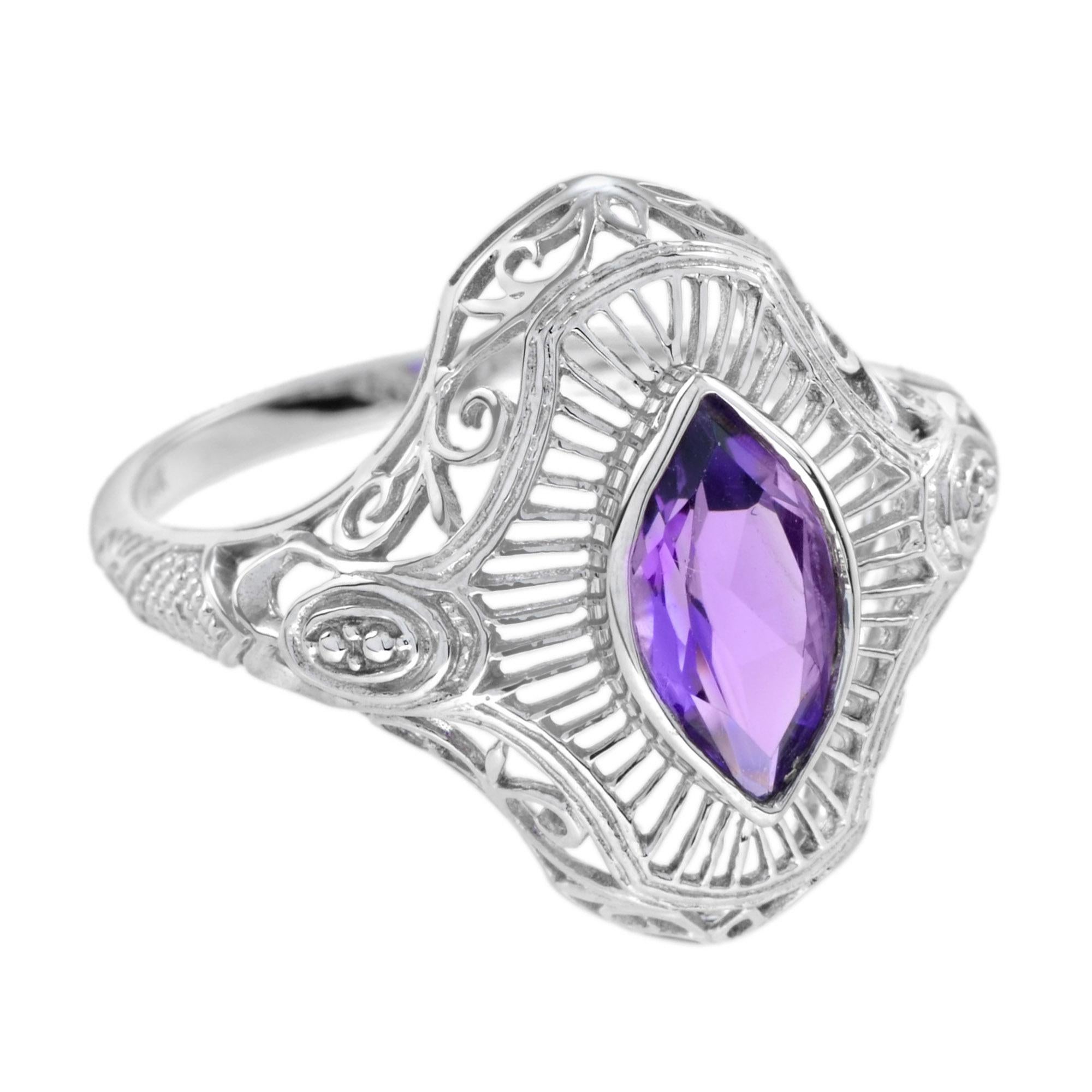 Majestic in its vintage design, the ring is a work of art itself. The marquise amethyst and filigree design are of remarkable detail, casting a beautiful aged beauty. Cut in a marquise shape, the main gemstone creates an illusion of greater size,