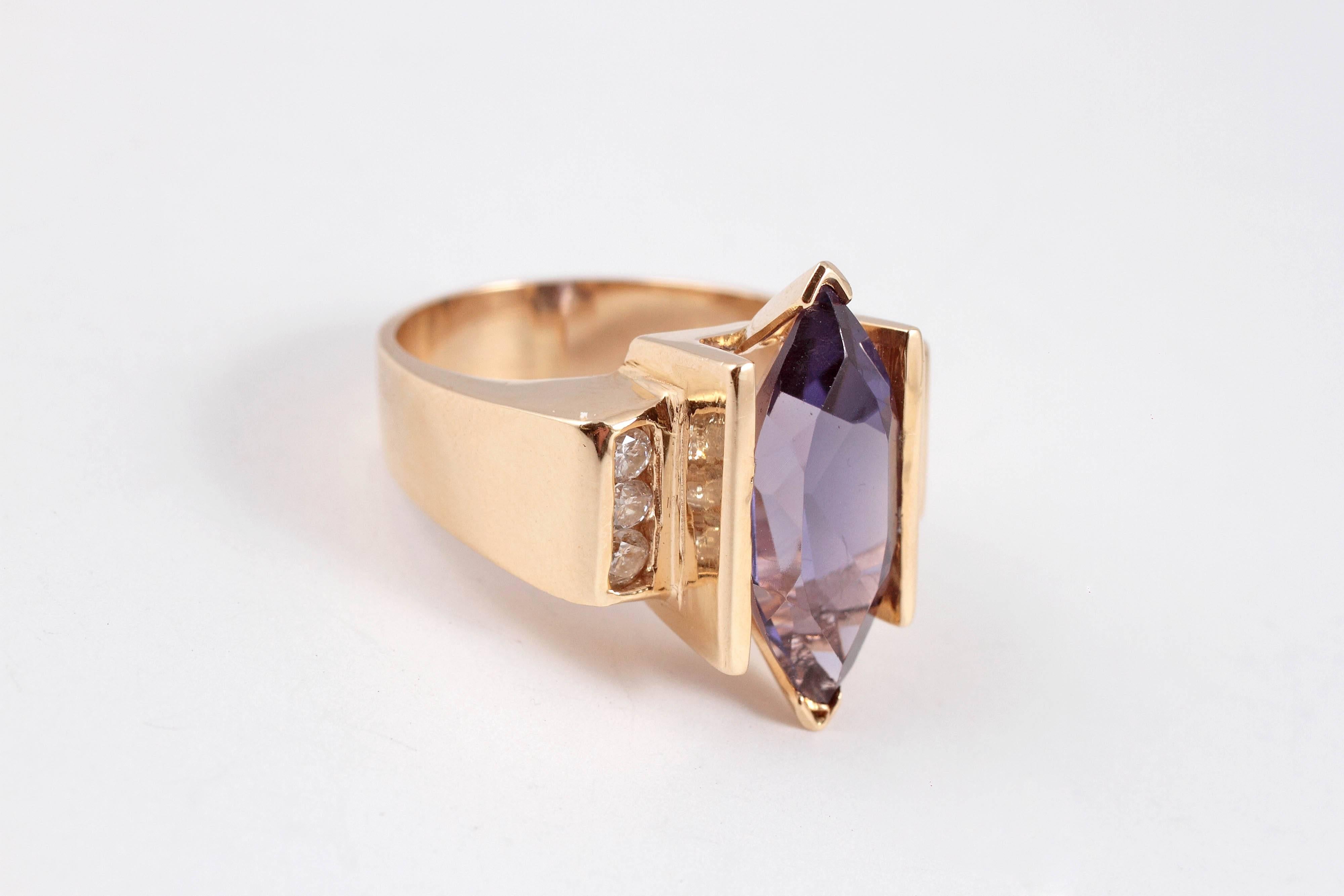 Not just for the February babies!  This beauty is composed of 14 karat yellow gold and features a lovely amethyst and accent diamonds.  Size 7 1/2.