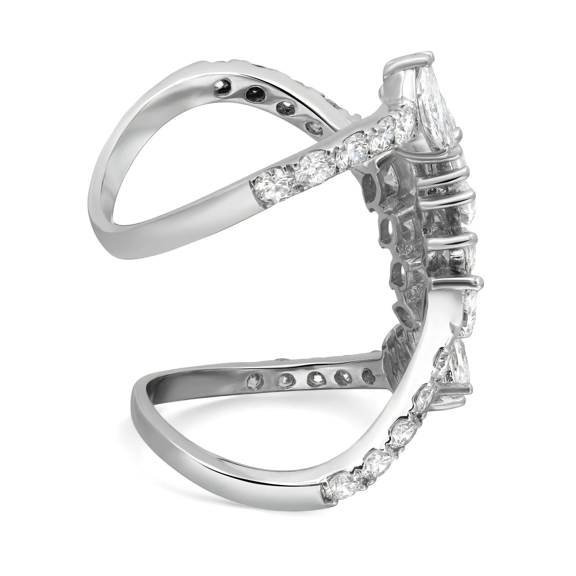 This luxurious ring is crafted from 18K white gold, offering a radiant, polished finish that enhances the brilliance of the marquise and round cut diamonds totaling 5.00 carats set in prong setting. The design features an elegant open style band