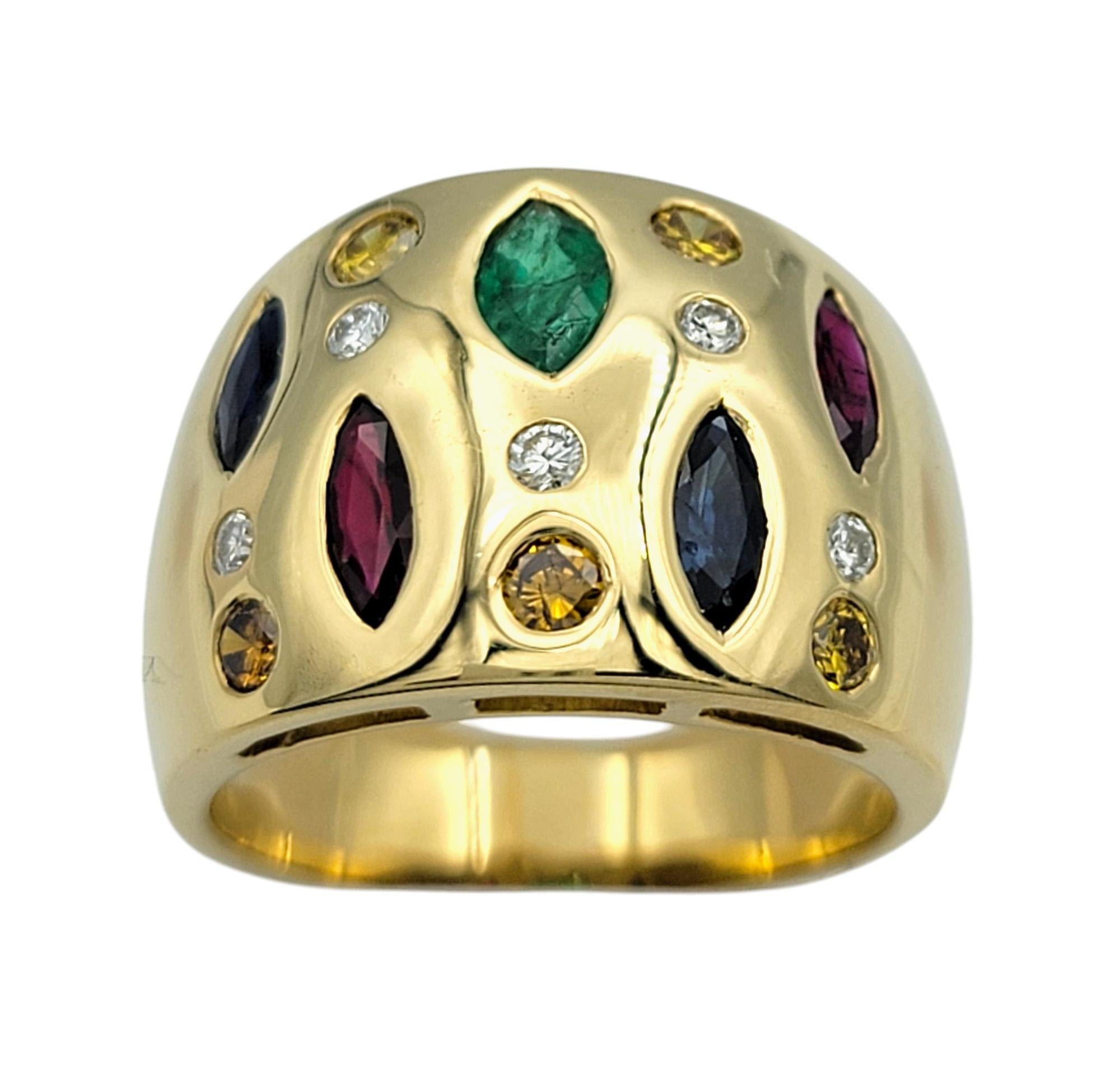 Ring Size: 8.5

This vibrant multi-colored gemstone and diamond ring is a bold statement piece, beautifully crafted in 18 karat yellow gold. The design features a collection of dazzling gemstones, including rich red rubies, deep blue sapphires,
