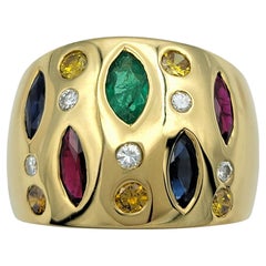 Breiter Ring aus 18 Karat Gelbgold mit Marquise und Rundschliff mit mehreren Edelsteinen