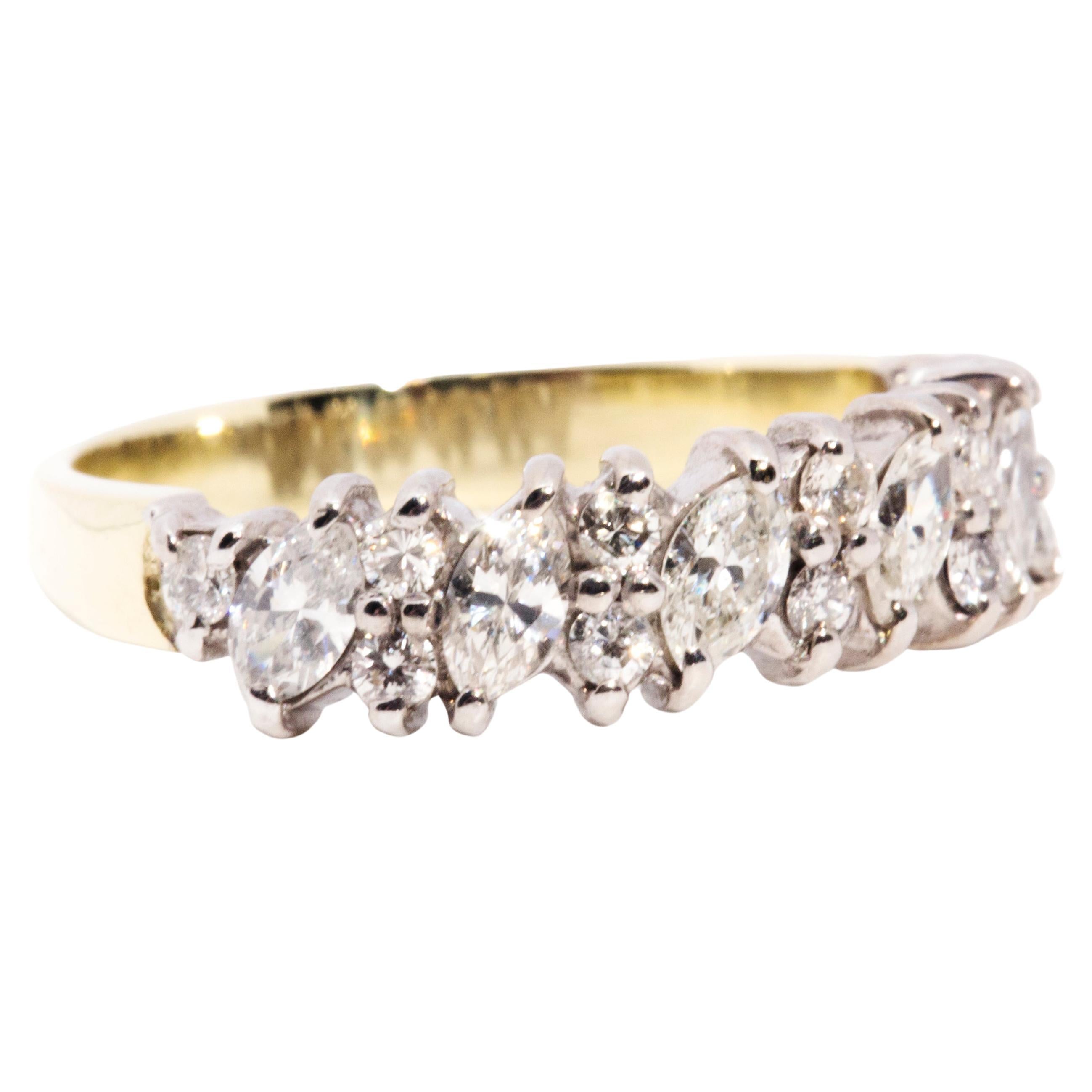 Crafted in 18 carat gold, this enchanting vintage ring is embellished with six shimmering marquise cut diamonds alternating with six pairs of sparkling round brilliant cut diamonds. This darling jewel has been named The Ezra Ring. She invokes