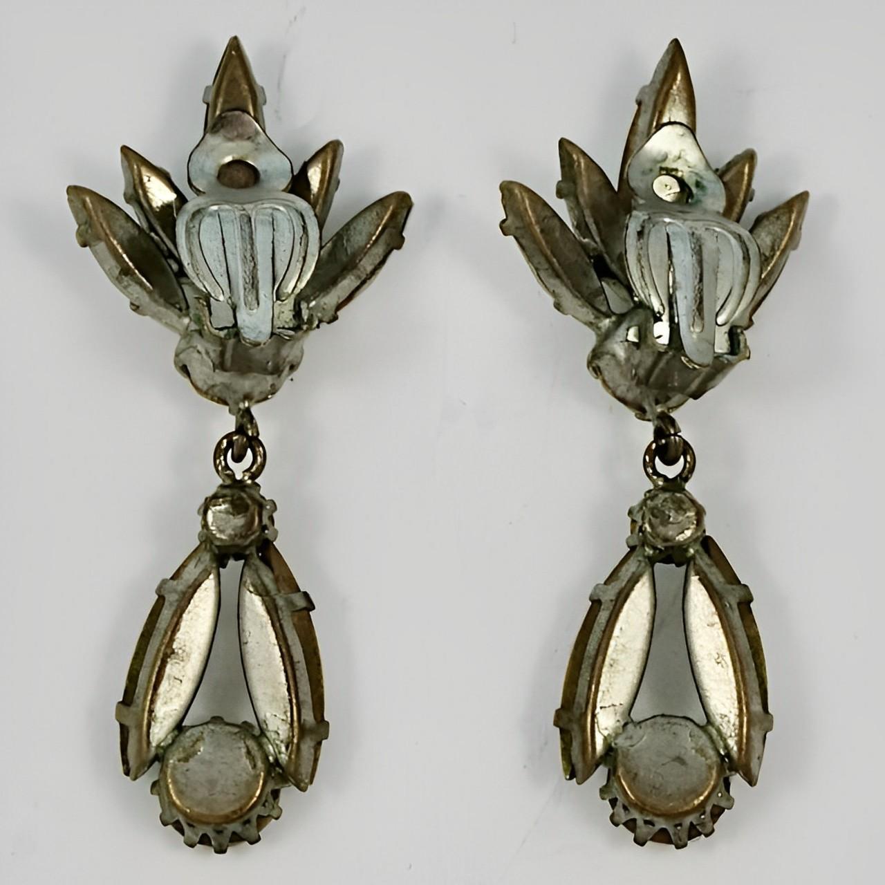 Beautiful silver tone drop clip earrings featuring marquise and round rhinestones. Measuring length 4.9 cm / 1.9 inches

These are stylish vintage drop earrings, circa 1950s. Wonderful for evening  or special occasion wear.