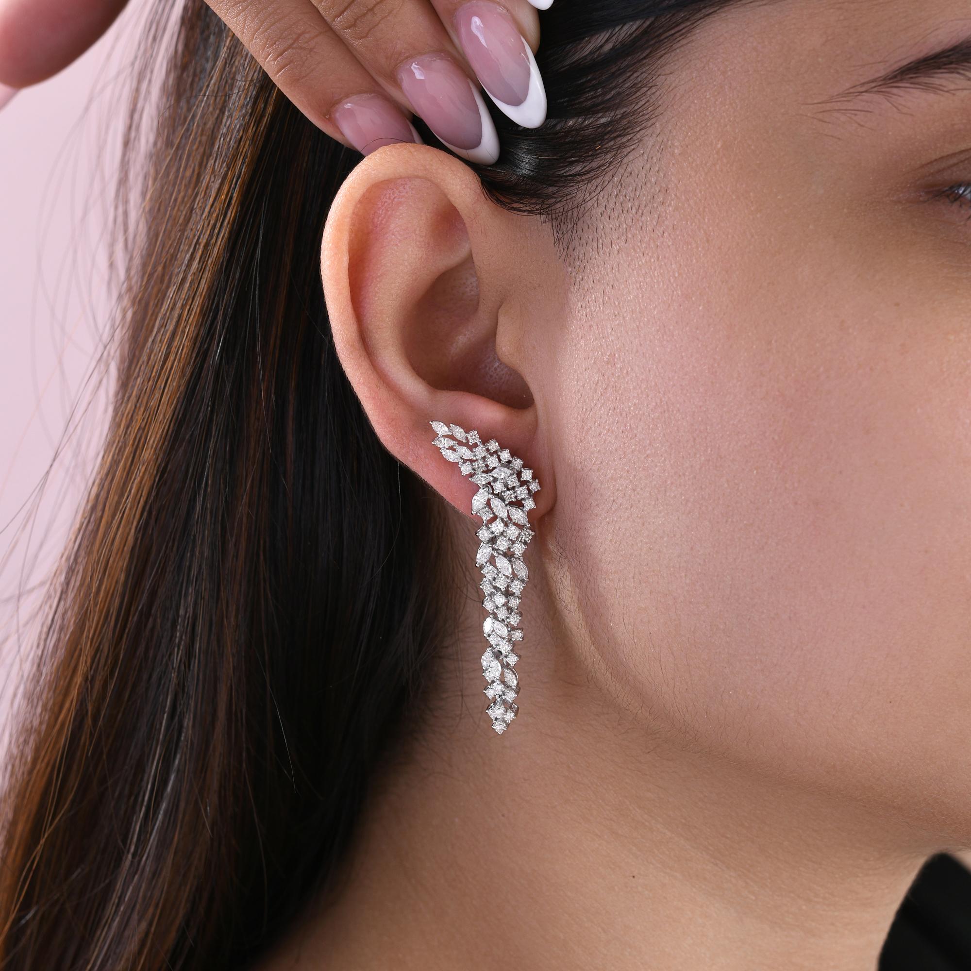 Marquise and Round Statement Long Cluster Diamond Earrings 18 Karat White Gold 
These breathtaking cascading earrings feature a flowing vine-like design made of shimmering simulated diamonds arranged in round, and marquise. Each stone is