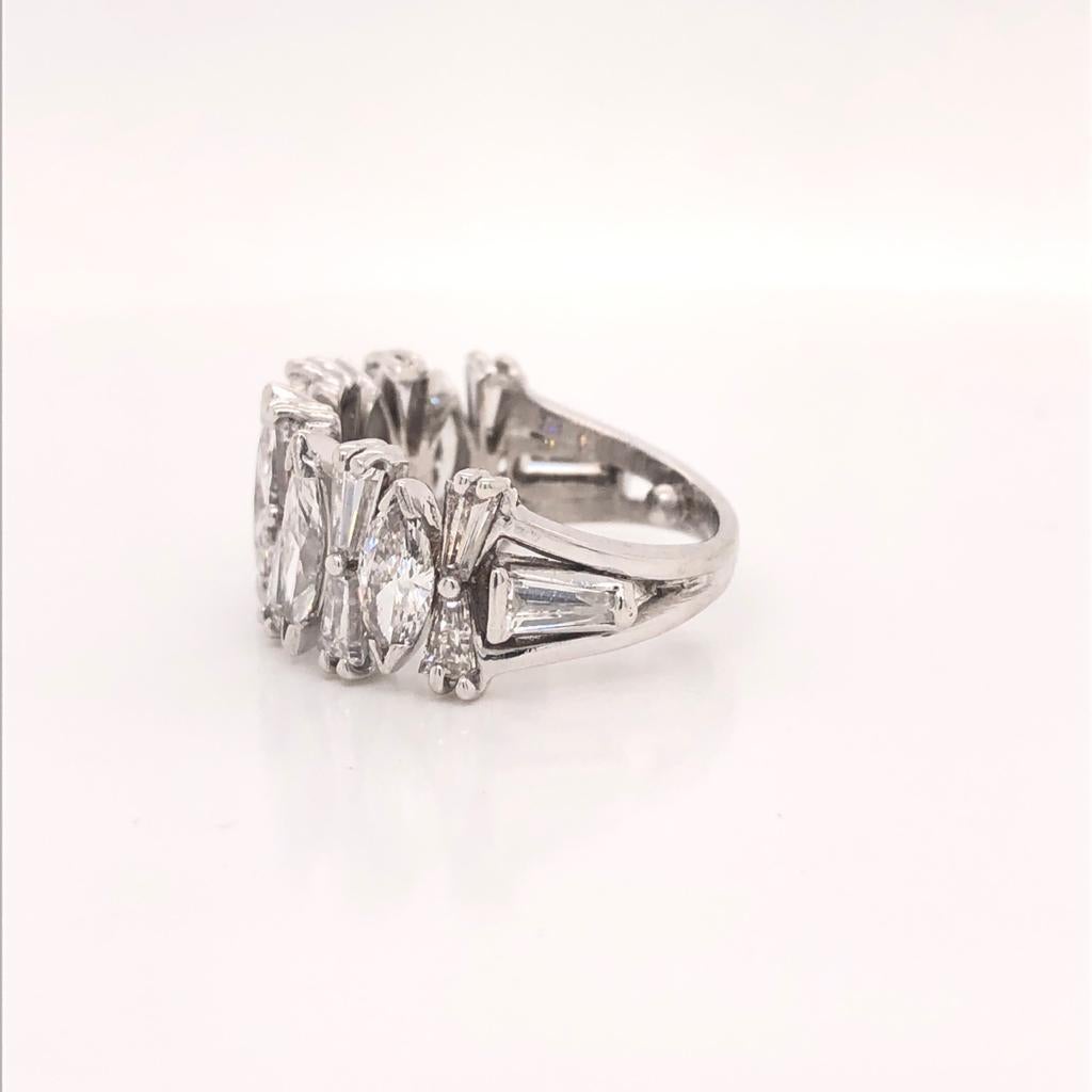 Unique and Elongating Marquise and Tapered Baguette Half Diamond Band  Cafted in Platinum Ring 
Diamond Weight: 2ct
Shape/Cut: Marquise (5 stones approx 0.40ct)
Color: F
Clarity: VVS
Diamond Weight: 1.8ct
Shape/Cut: Trapered (12 stones approx