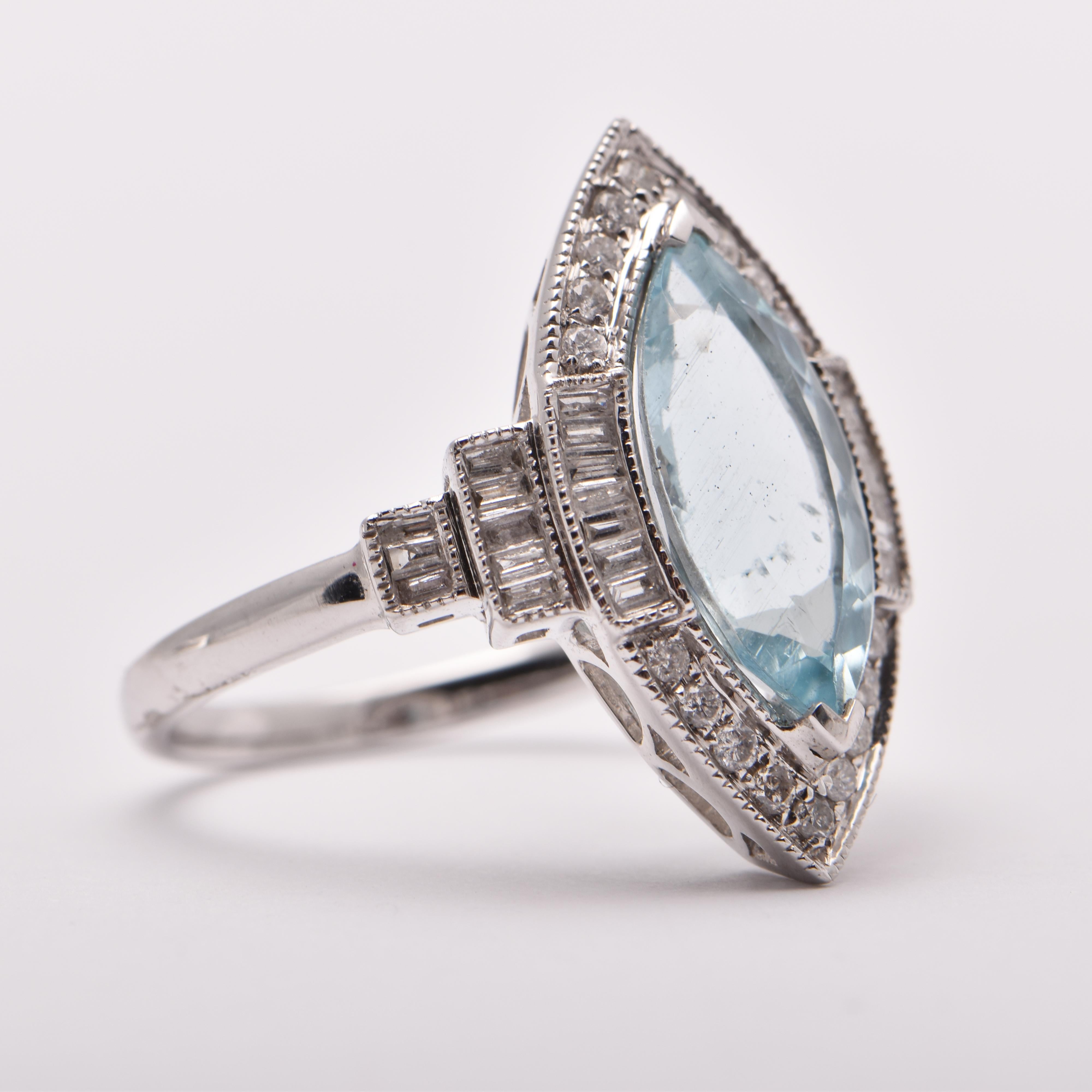 Marquise Aquamarine and Diamond Cocktail Ring in 18 Carat White Gold by Cartmer Jewellery   

Size M 
1 Emerald 1.89 Carats  
18 Diamonds 0.38 Carats 
18 Carat White Gold Ring  

FREE express postage usually 3-4 days Sydney to New York 
FREE