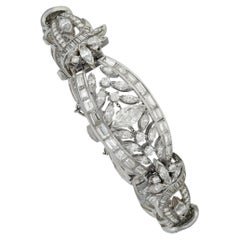Bracelet élégant en or blanc et platine avec diamants taille ronde et baguette marquise