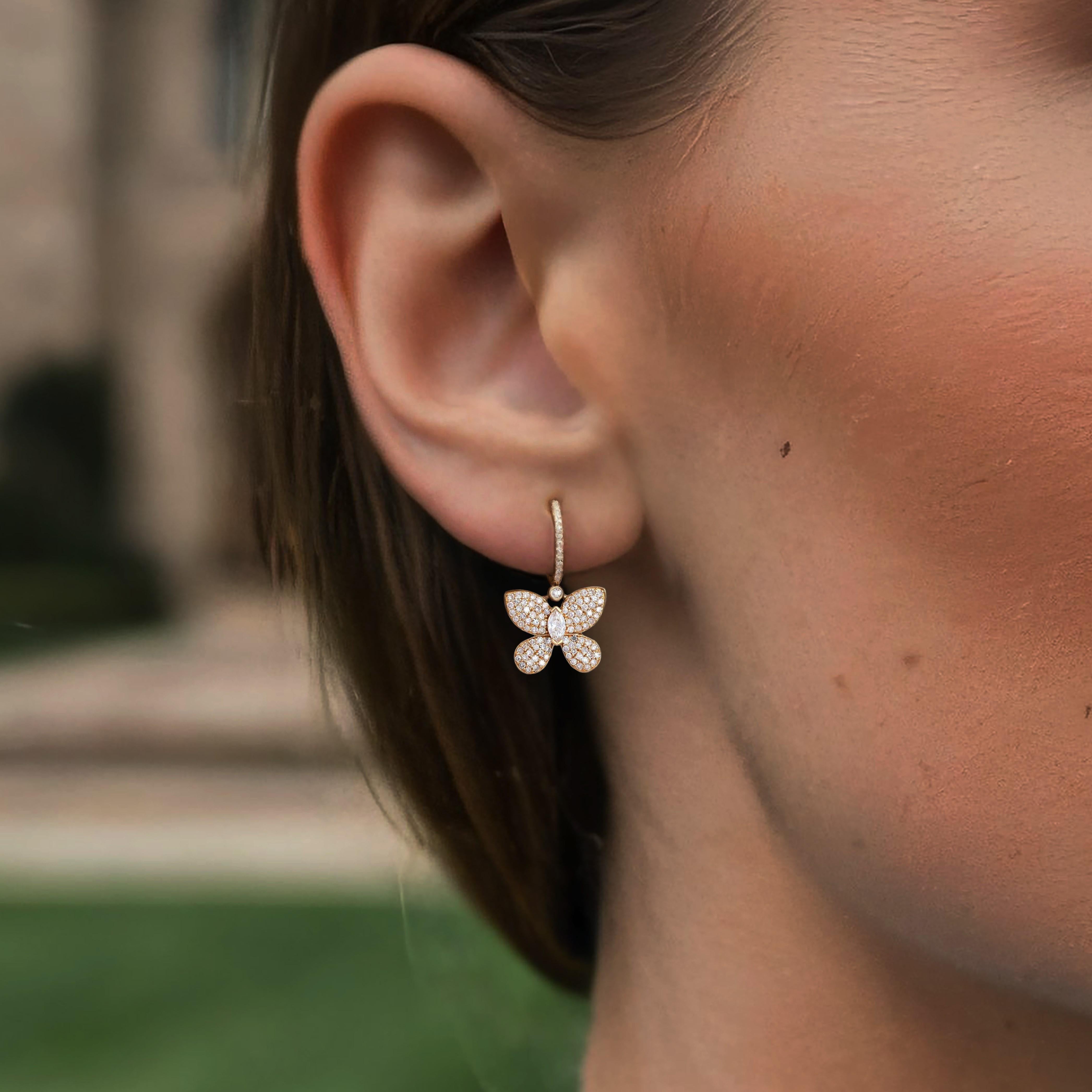Crafted in 14K yellow gold, these exquisite earrings feature natural diamonds and fancy diamonds. The earrings sparkle with 0.66ct of diamonds and 0.18ct of marquise-shaped diamonds, creating a stunning cascade effect. A perfect choice for those