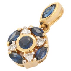 Marquise Cut Blue Sapphire Indian Style Pendant in 18K Yellow Gold with Diamonds
