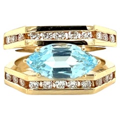 Marquise Cut Blue Topaz and Diamond Ring in 14k Gold