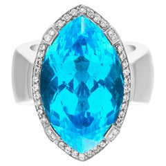 Vintage Marquise cut Blue topaz & diamonds ring set in 18k white gold.