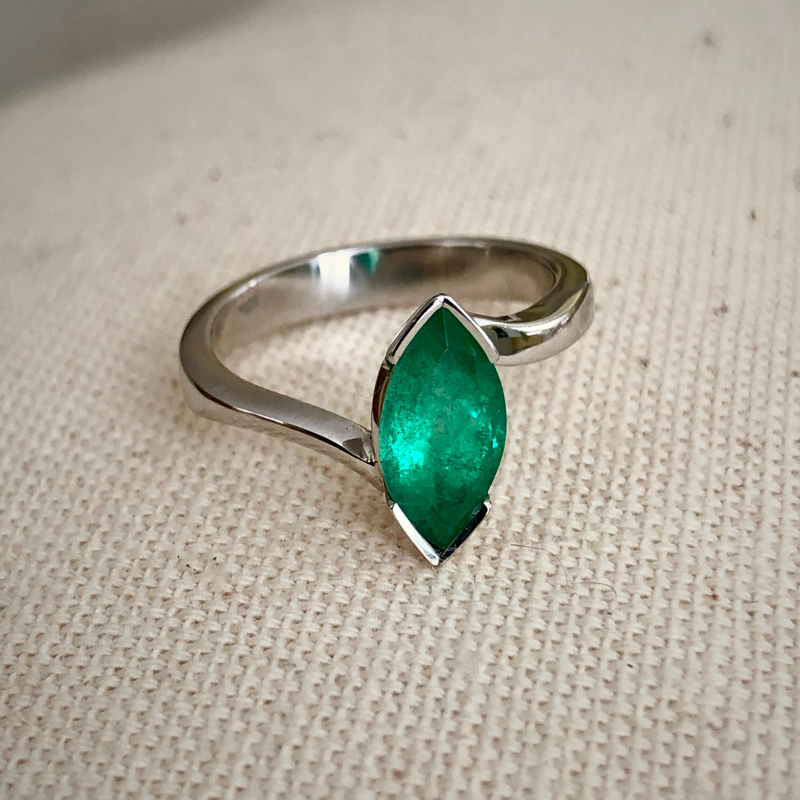 
Classic Solitaire Colombian Emerald Solitaire Engagement Ring 18 Karat White Gold
Vibrant green color Approx. 1.30 carat natural Colombian emerald marquise cut embedded in 18k white gold. 
Ring size is 6.75( resizable)
Total Ring Weight: 4.1g
