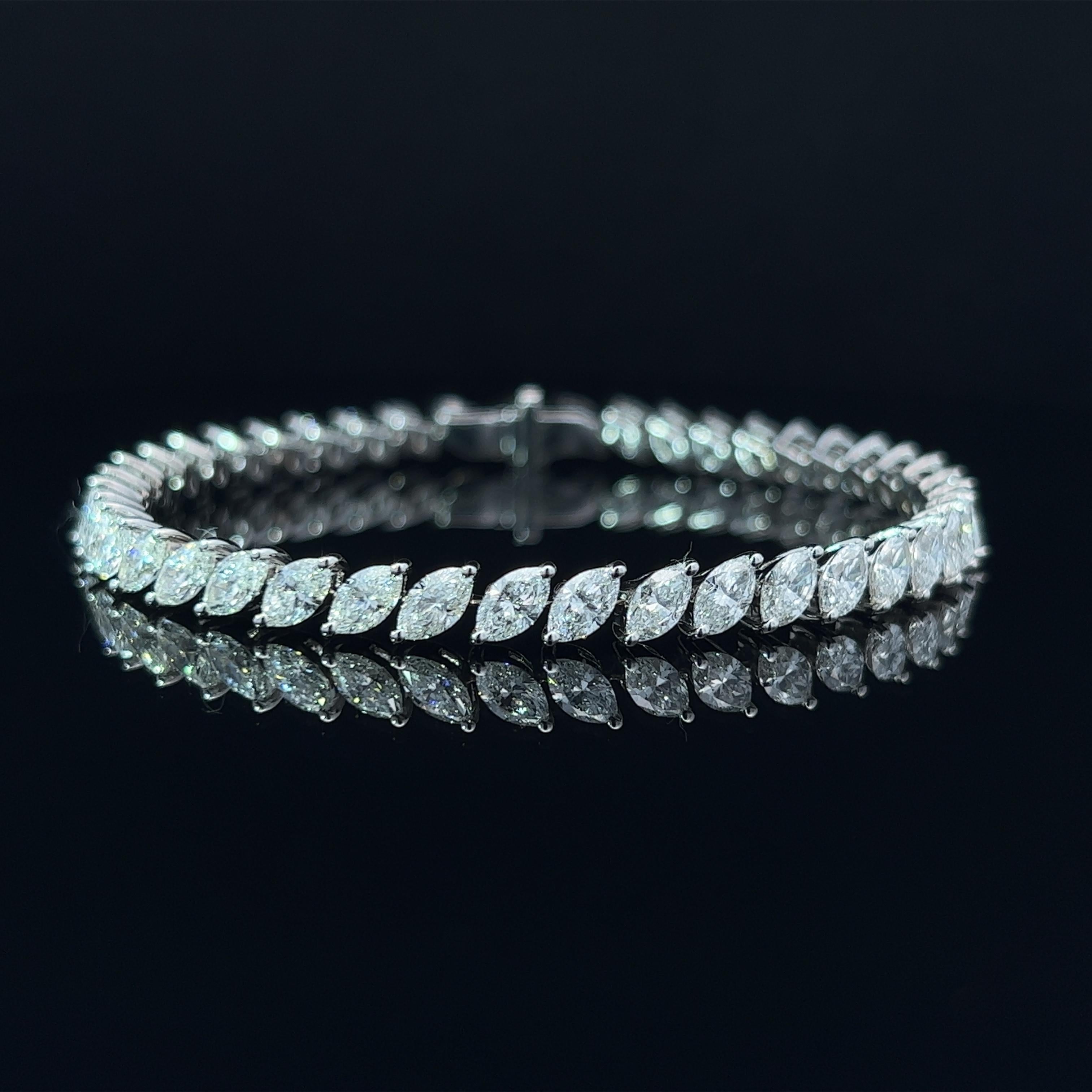 Diamond Shape: Marquise Cut 
Total Diamond Weight: 10.2ct
Individual Diamond Weight: .25ct
Color/Clarity: FG VVS  
Metal: 18K White Gold  
Metal Weight: 14.6g 

Key Features:

Marquise-Cut Diamonds: The centerpiece of this bracelet features a