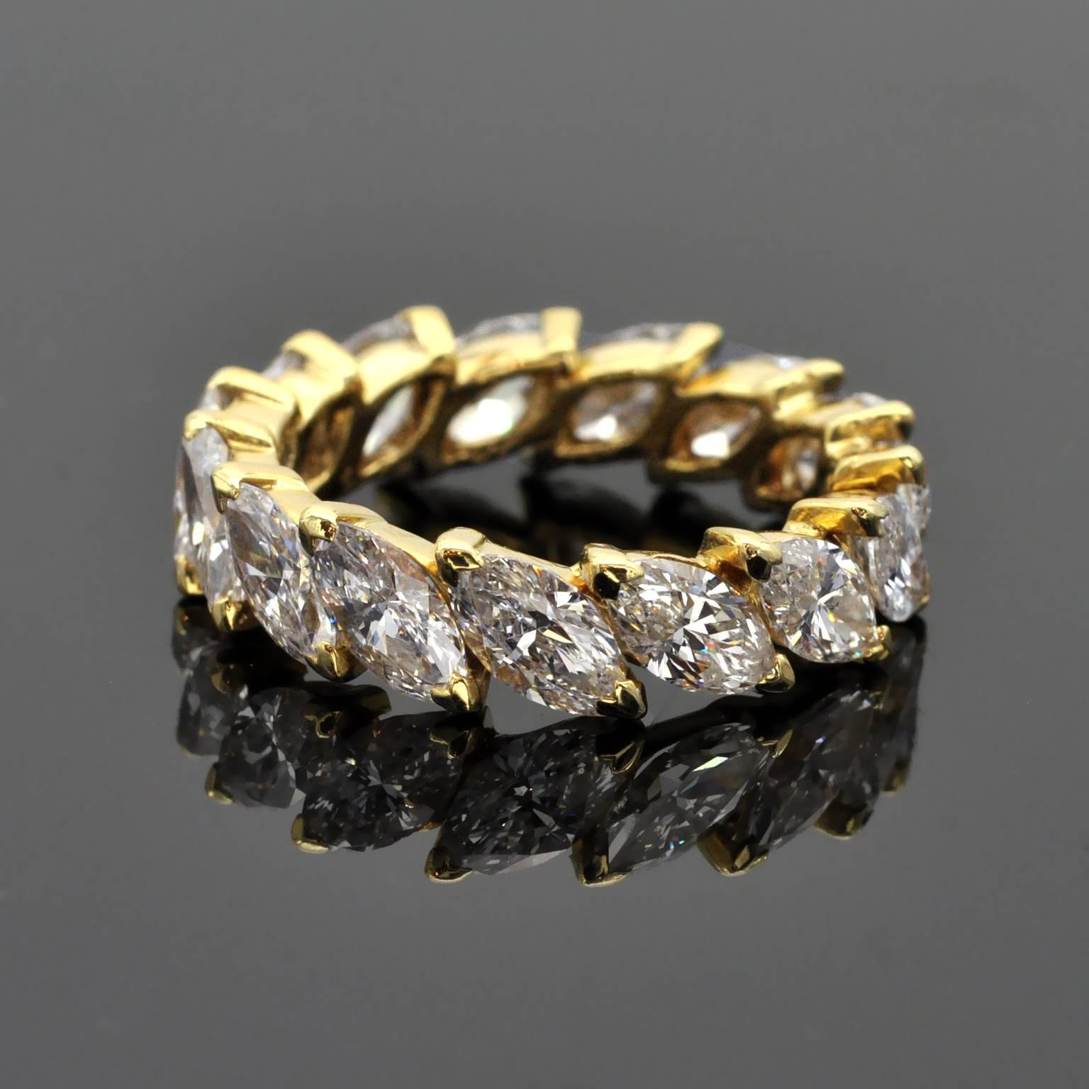 Important wedding band composed of  15 marquise cut diamonds each about 0.30 carat , approximately 4.50 carat in total. The diamonds are FG in colour ad VS or better in clarity.  The ring is very well made in 18KT gold and bears the french 