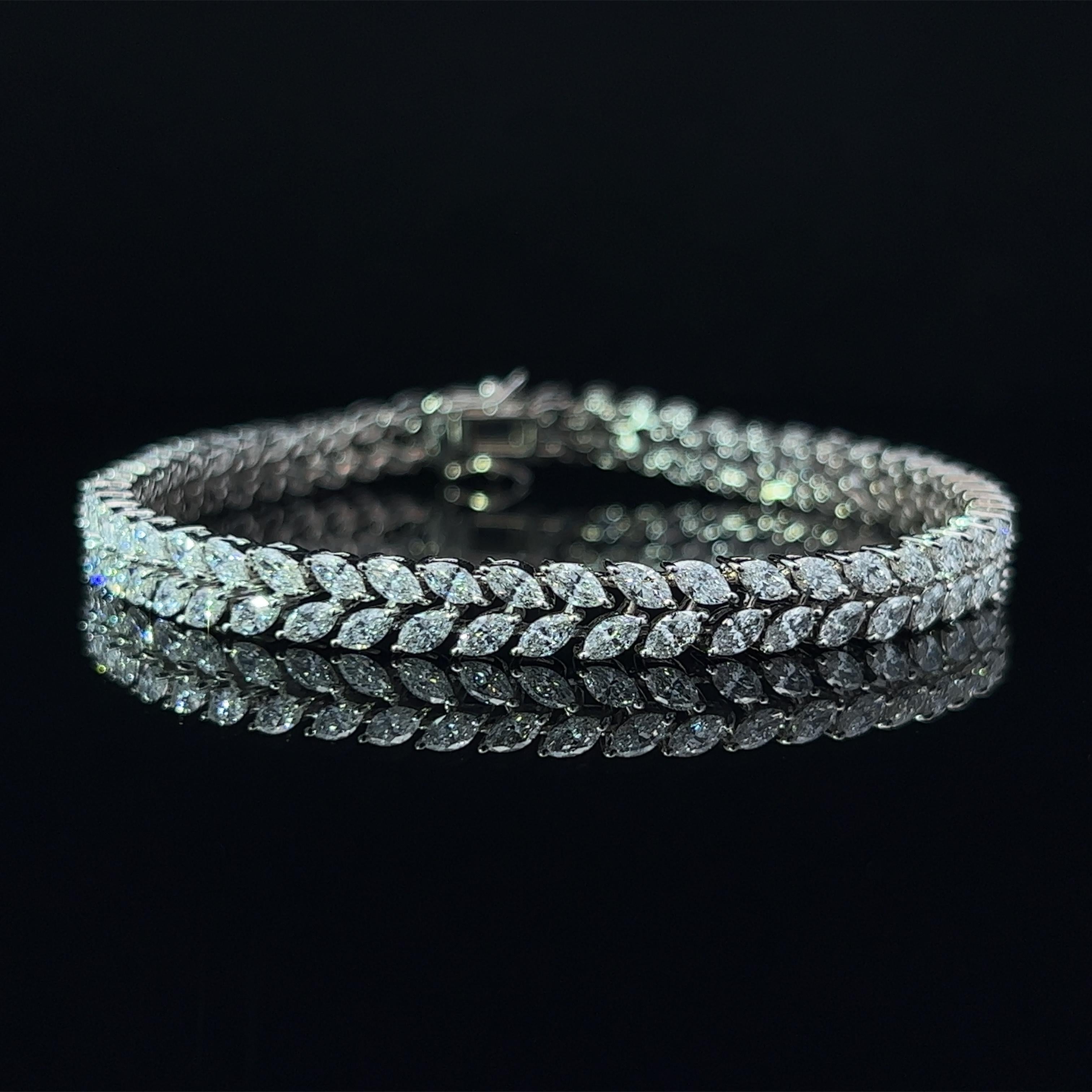Diamond Shape: Marquise 
Total Diamond Weight: 7.14ct
Individual Diamond Weight: .10ct
Color/Clarity: GH VVS  
Metal: 18K White Gold  
Metal Weight: 15.47g 

Key Features:

Marquise-Cut Diamonds: The centerpiece of this bracelet features a dazzling