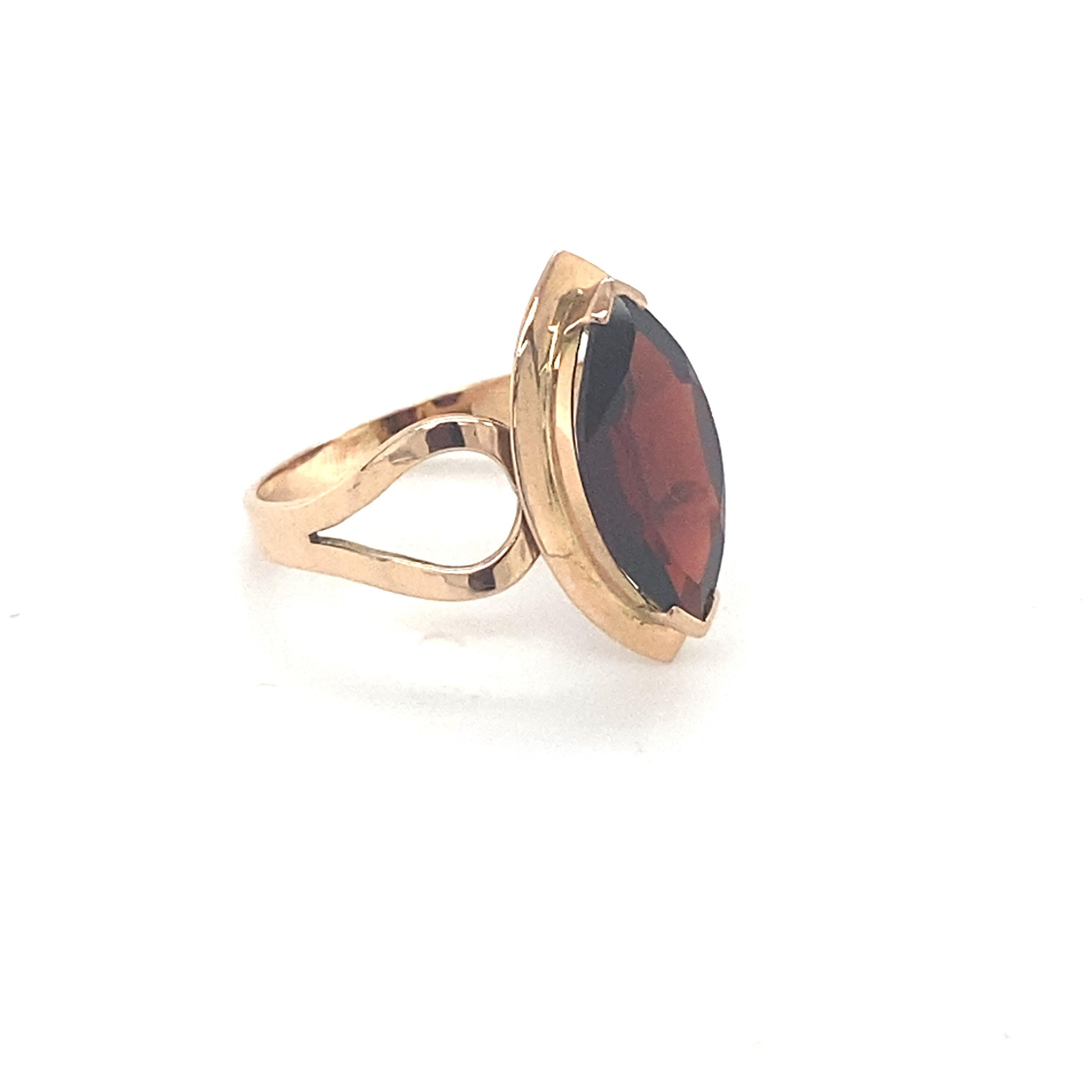 Marquise cut garnet is mounted in 14K yellow gold. Beautifully hand crafted ring in is suitable for your everyday wear. Carefully chosen gem stone is hand cut and polished. One of a kind ring to suit your style. Its elegant and comfortable to