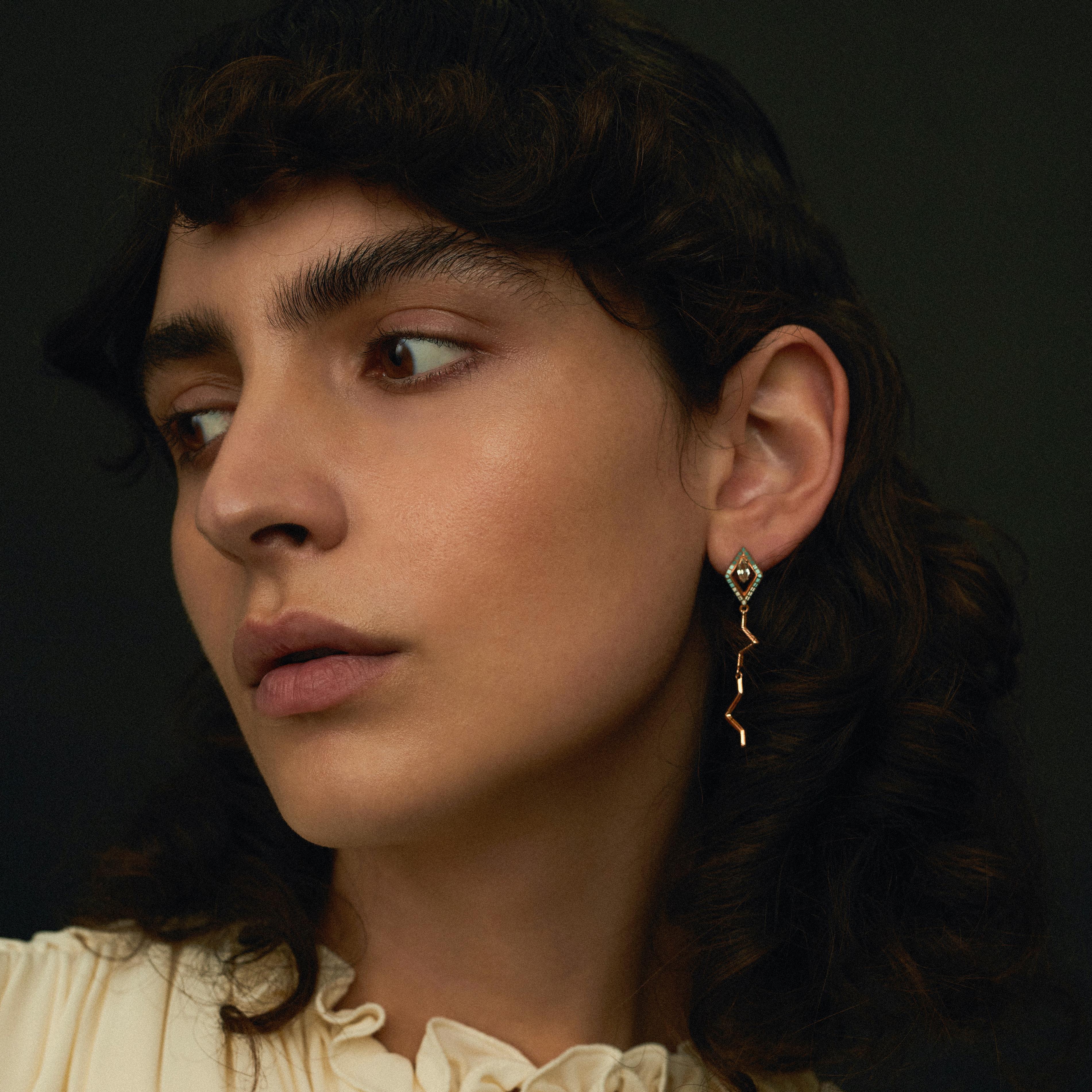 Inspired by the popular antique arcade game 'Snake', the Pipa Earrings are a comical reflection of our modern life. The 'snake' manoeuvres in a line that grows in length. With the line itself being a primary obstacle, it aims to grow and avoid