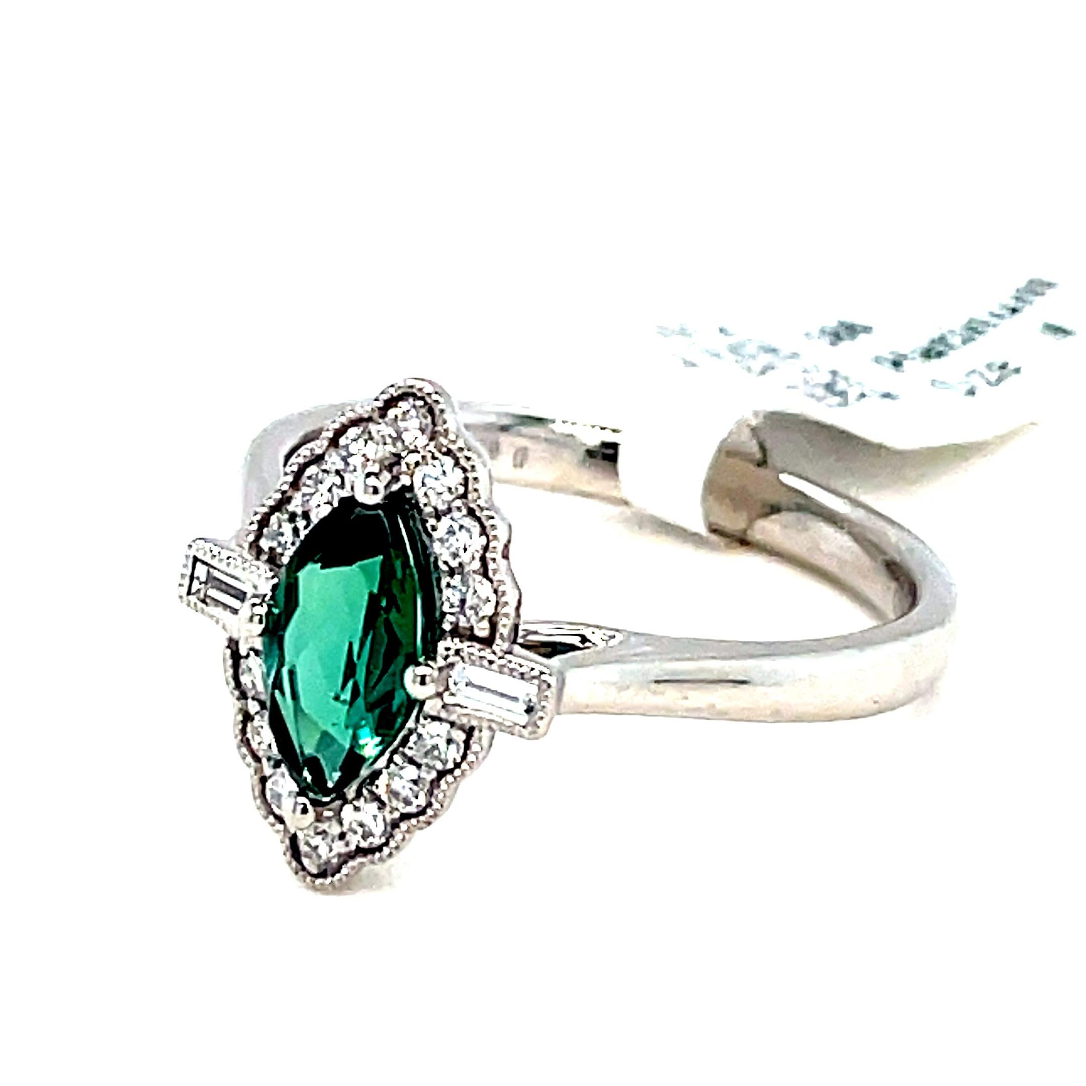 Indulge in the timeless allure of Art Deco with this exquisite ring. The design embodies the era’s signature geometric lines and symmetrical patterns, creating a visually striking piece.

At the heart of this masterpiece lies a captivating