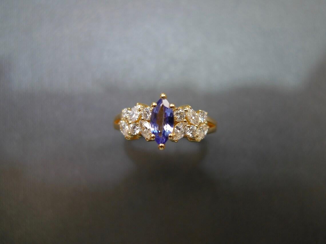 For Sale:  Marquise Cut Natural Tanzanite and Diamond Engagement Ring in 18K Yellow Gold 5