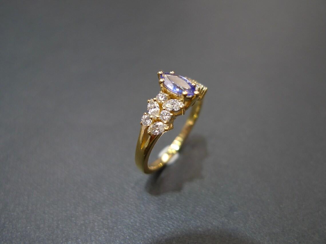 For Sale:  Marquise Cut Natural Tanzanite and Diamond Engagement Ring in 18K Yellow Gold 9