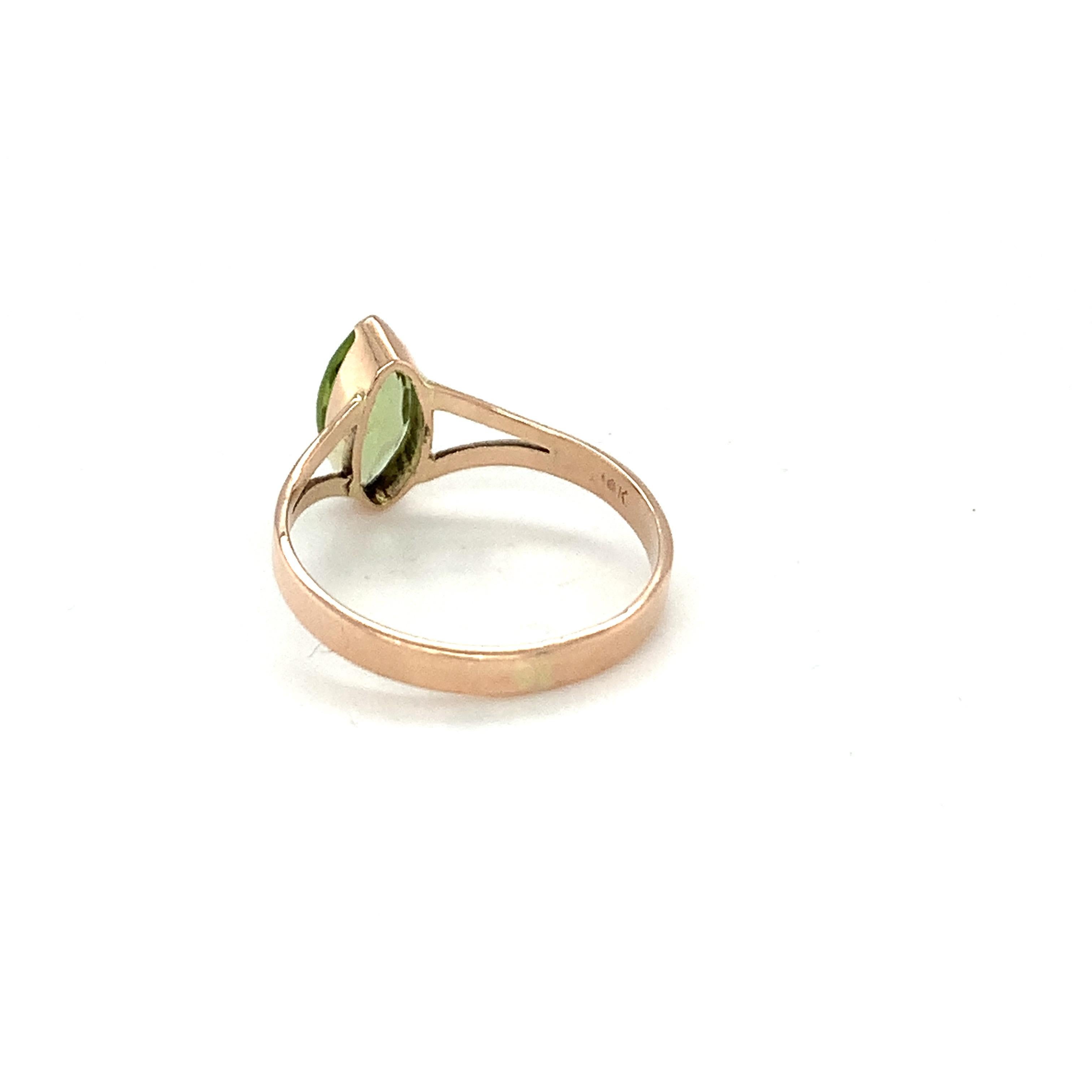 Women's Marquise Cut Peridot Ring Set in 14k Yellow Gold For Sale