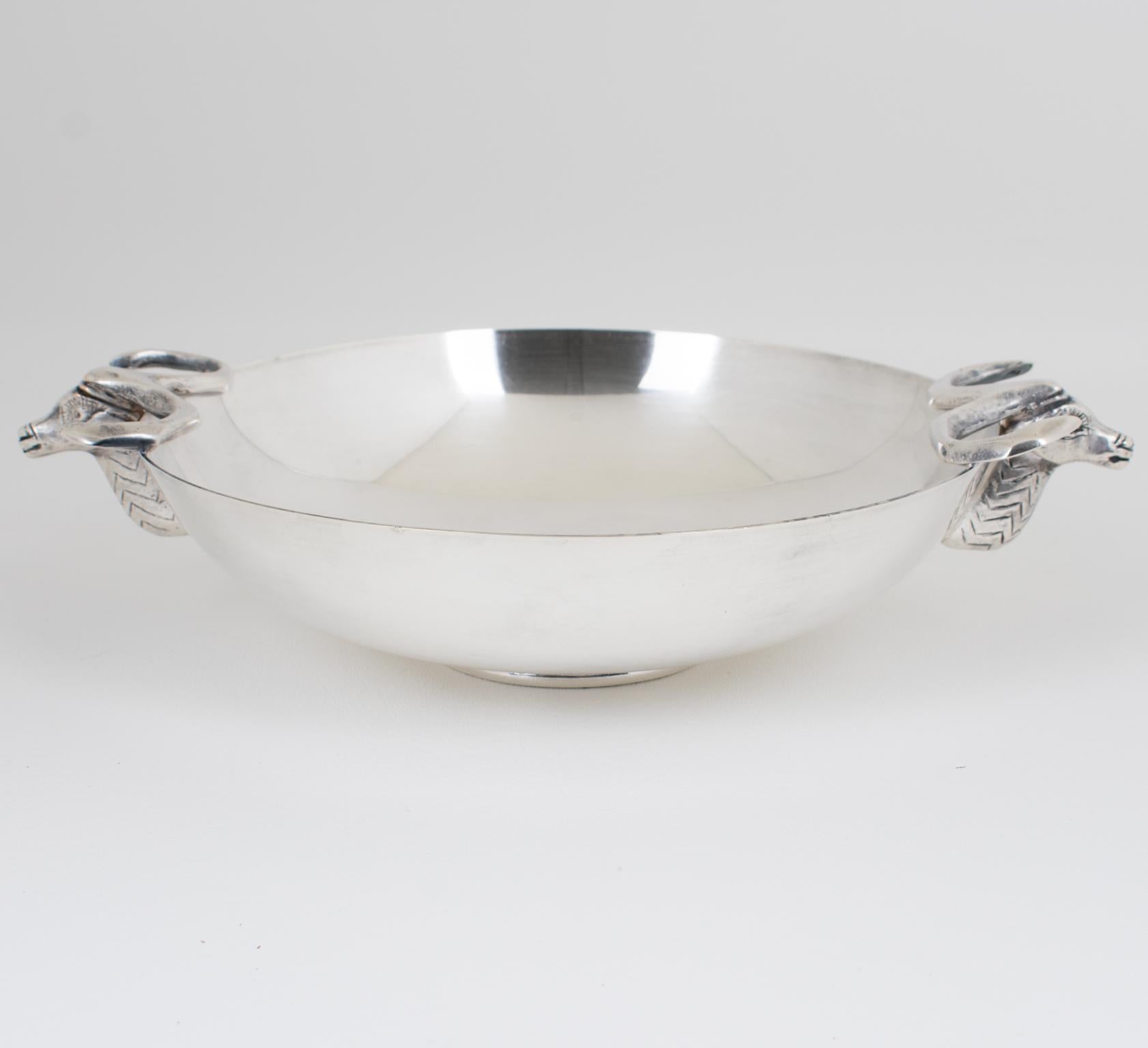 This rare Art Deco silver plate candy bowl was hand-crafted for A La Marquise De Sévigné, the finest Paris chocolate store in the 1930s. The round Art Deco modernist shape has stylized deer heads on both sides as handles. The candy serving dish is