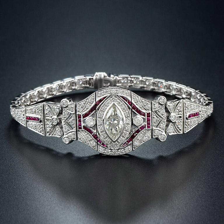 Fancy Diamond weight 2.50 Carat Diamond set on the 18K White Gold Art Deco Bracelet.

The item was also set with 1.50 Carat of Natural Burmese Ruby which cutting in French Cut Style and another 3.45 Carat of Full Cut Diamonds H color SI2 Clarity.