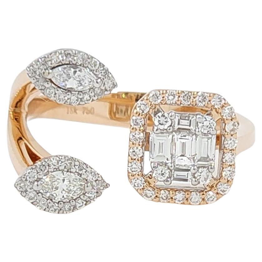  The ring in the image you've provided is a striking piece, combining the warm luster of 18K rose gold with the brilliance of marquise and round diamonds, totaling 0.67 carats. The design is contemporary, with an open setting that features the