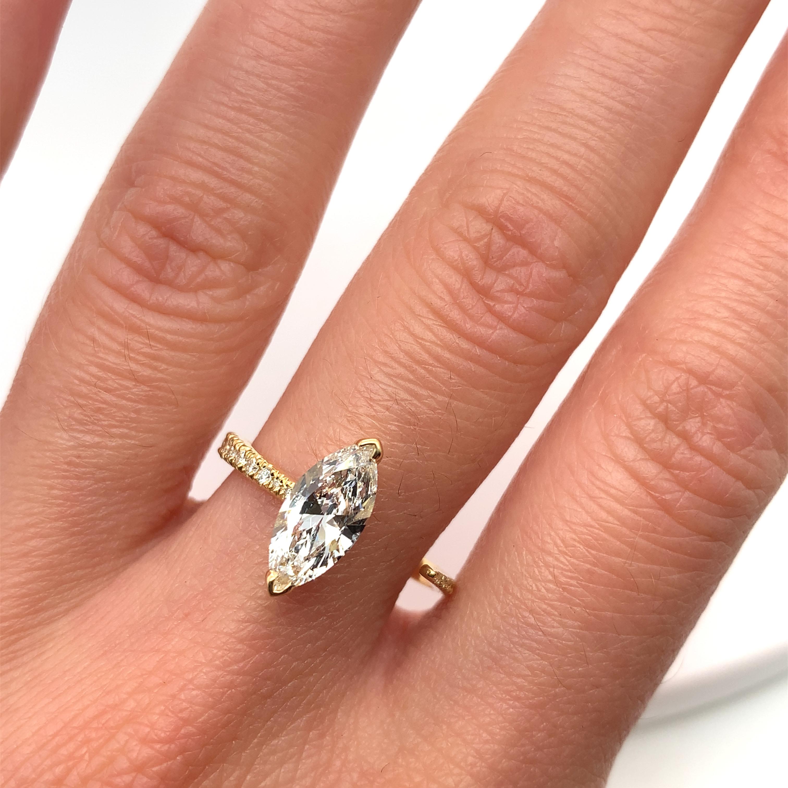 This stunning engagement ring or cocktail ring is the perfect way to express your love and commitment. Crafted from 18ct yellow gold and featuring a beautiful marquise-shaped diamond, this ring is sure to make a statement. The band is chunky and