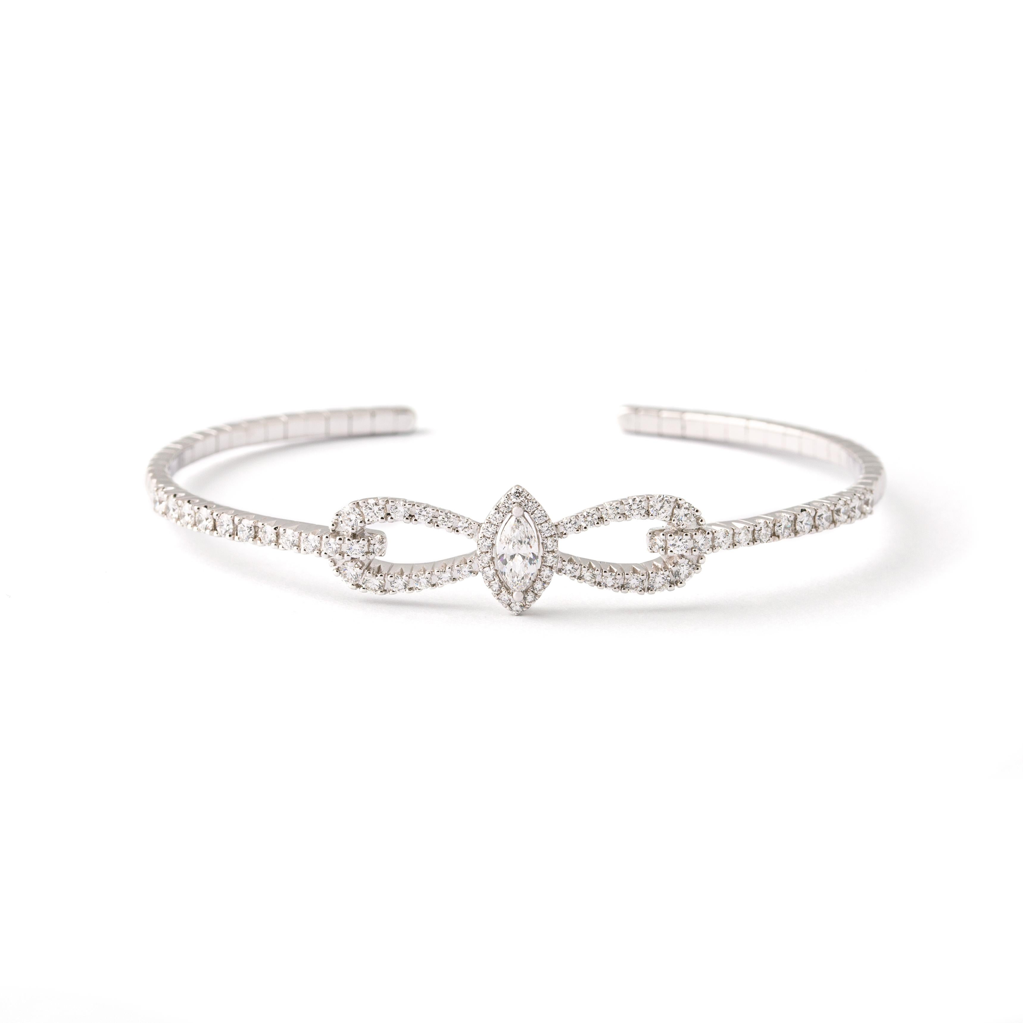 Bangle in 18kt white gold set with one marquise cut diamond 0.30 cts and 66 diamonds 1.37 cts.

Inner circumference: Approx. 17.27 centimeters (6.80 inches) up to 18.84 centimeters (7.42 inches).

Note: Flexible Bracelet.

Width on the top: 1.1